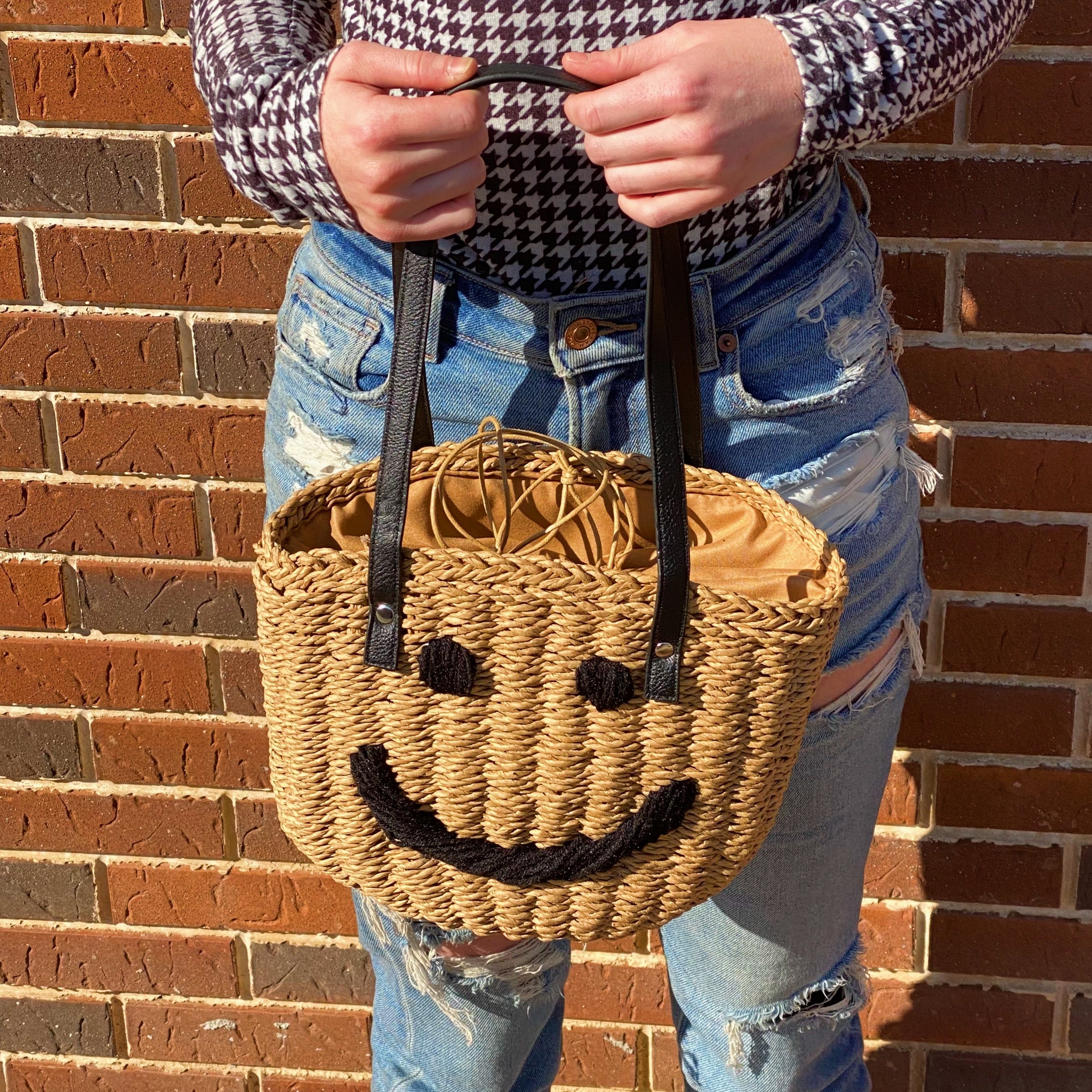 All Happy Vibes Bucket Bag featuring a cheerful woven design, cinch closure, and faux leather strap, perfect for summer outings.