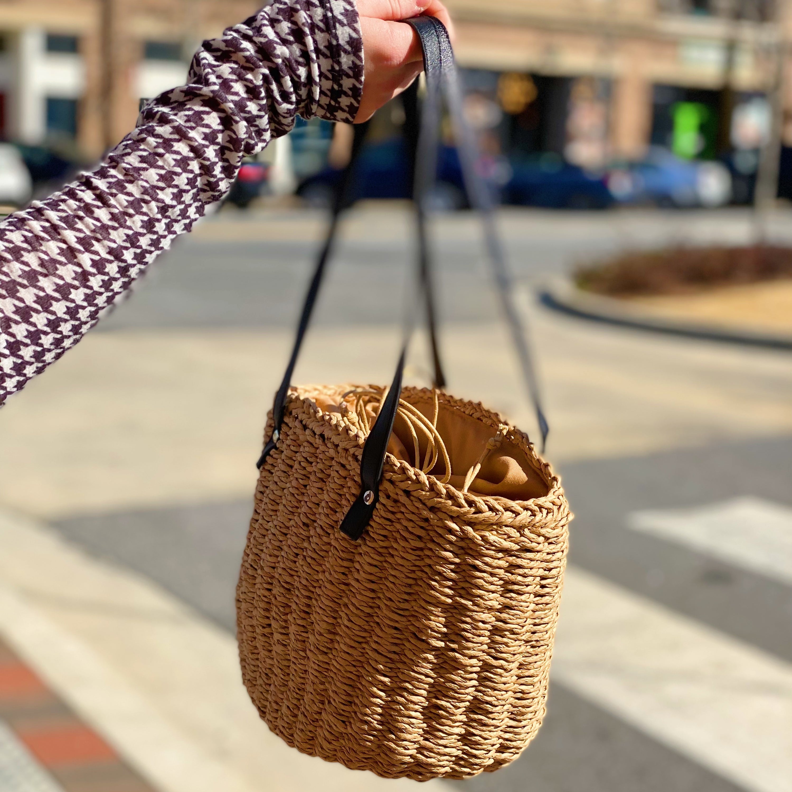 All Happy Vibes Bucket Bag featuring a cheerful woven design, cinch closure, and faux leather strap, perfect for summer outings.