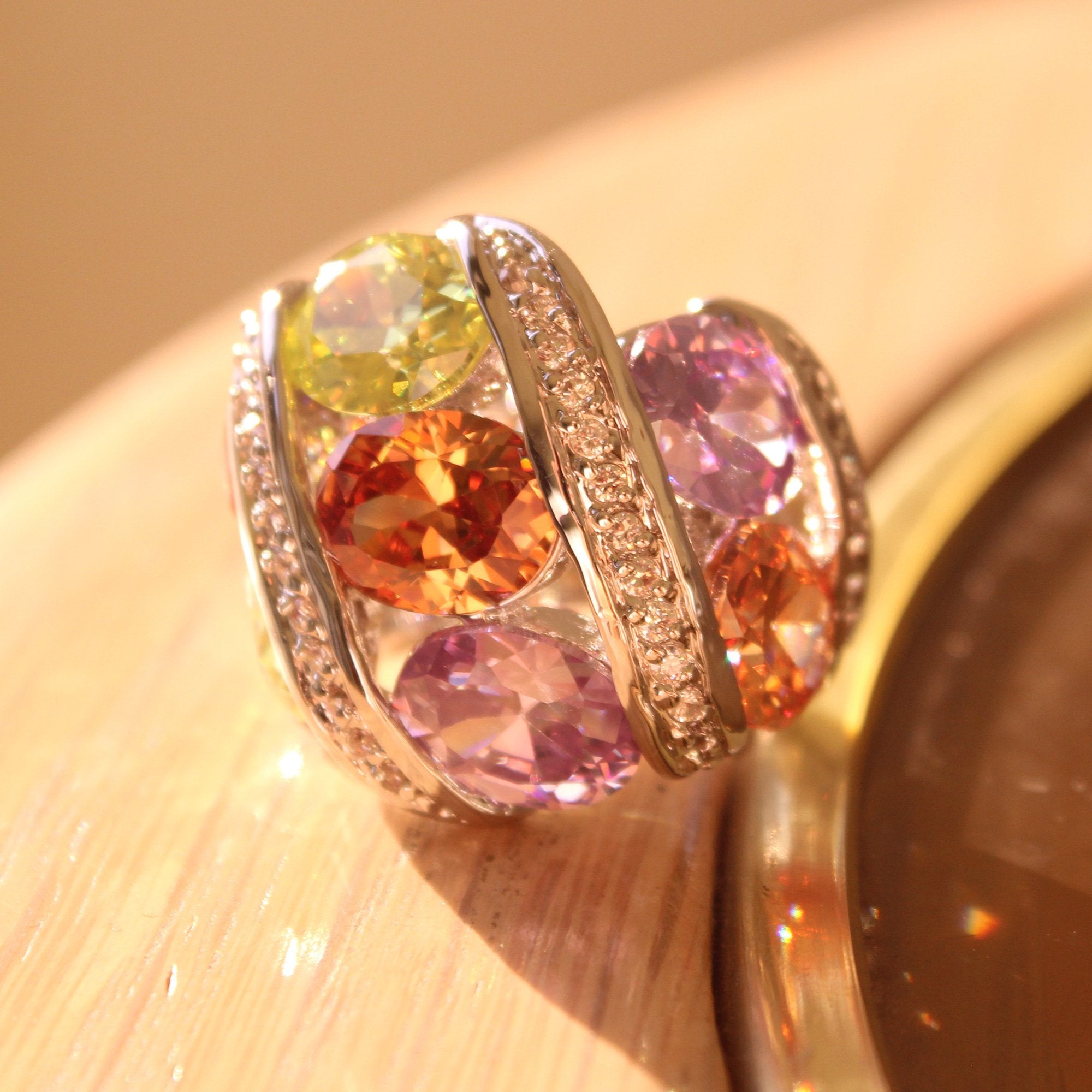 Alaina Cocktail Ring featuring a multi-color AAA CZ stone set in rhodium brass, showcasing elegance and style.