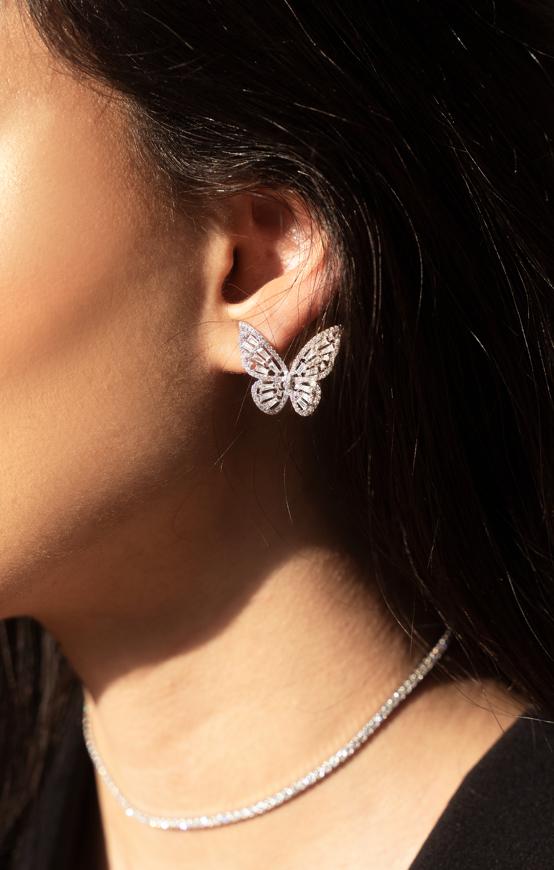 ALARA Butterfly Studs featuring intricate filigree design in platinum plating with sparkling cubic zirconia stones.