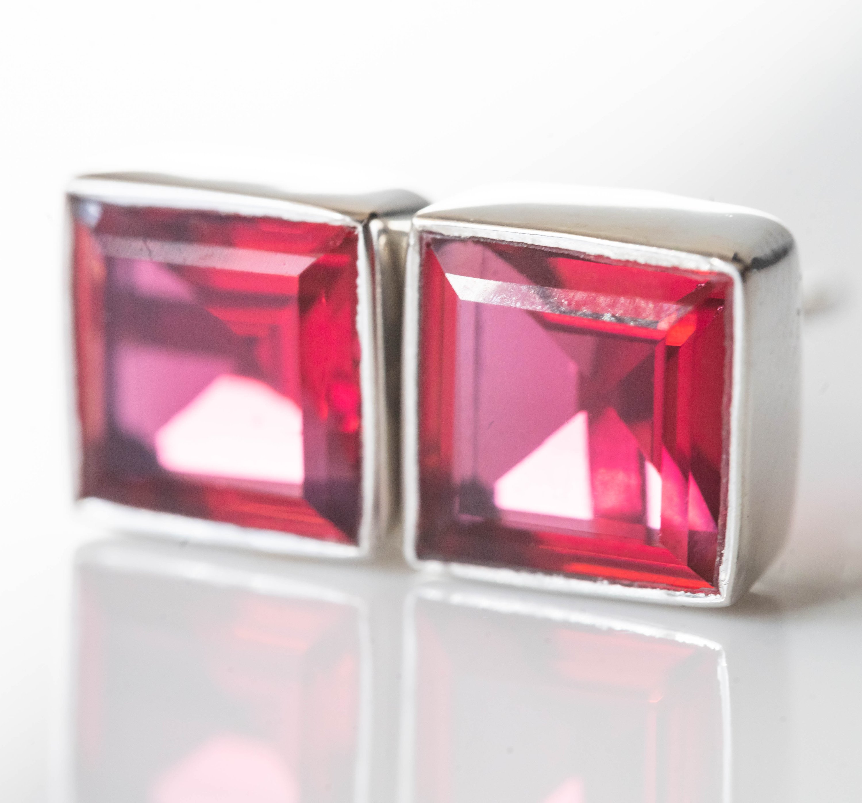 Elegant Alejandra Tourmaline Square Studs featuring red tourmaline stones set in 925 sterling silver with rhodium plating.