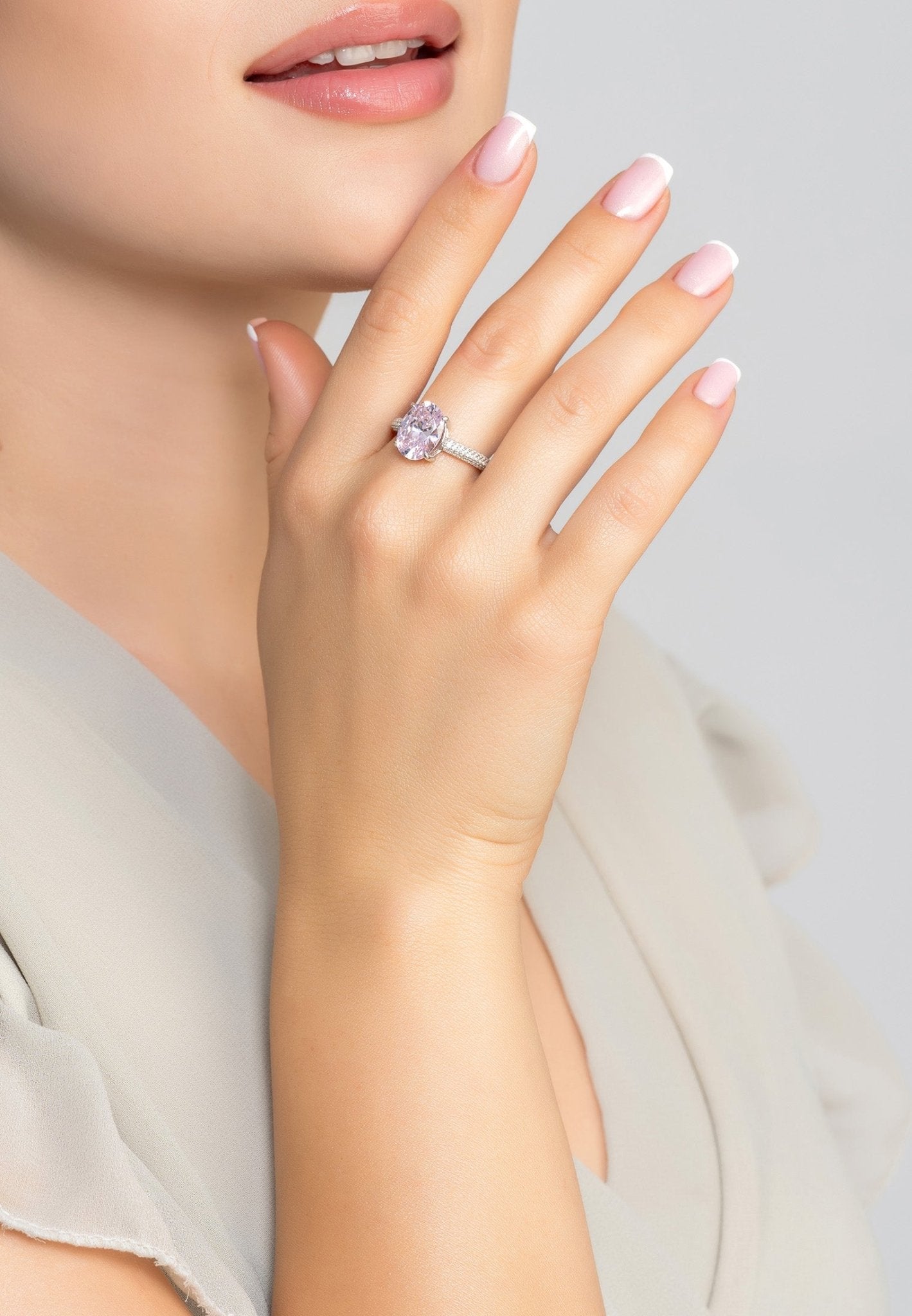 Alexandra Oval Cocktail Ring featuring a lab-created Morganite gemstone set in 925 sterling silver with simulated diamonds.