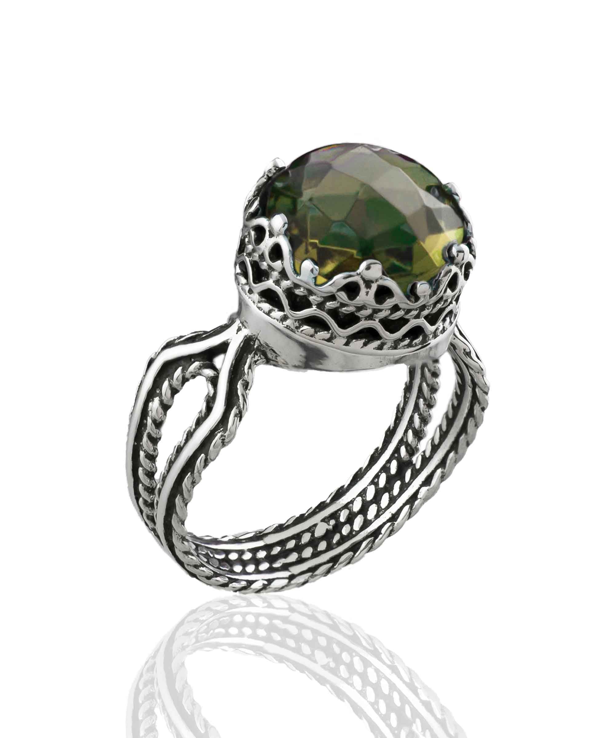 Elegant Alexandrite gemstone cocktail ring in sterling silver with intricate filigree design, showcasing a round-cut purple stone.