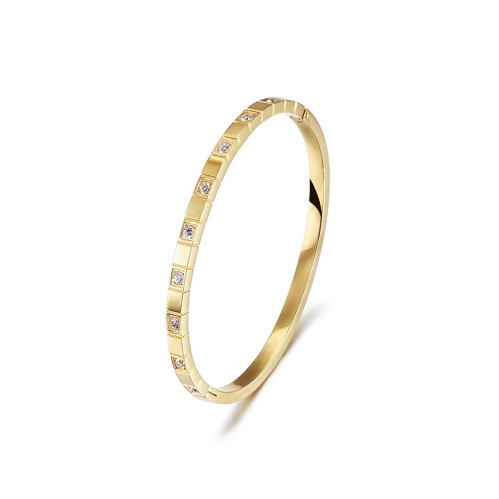 Alternate Pavé Stone Hinged Bangle made of surgical stainless steel with gold plating and sparkling stones.