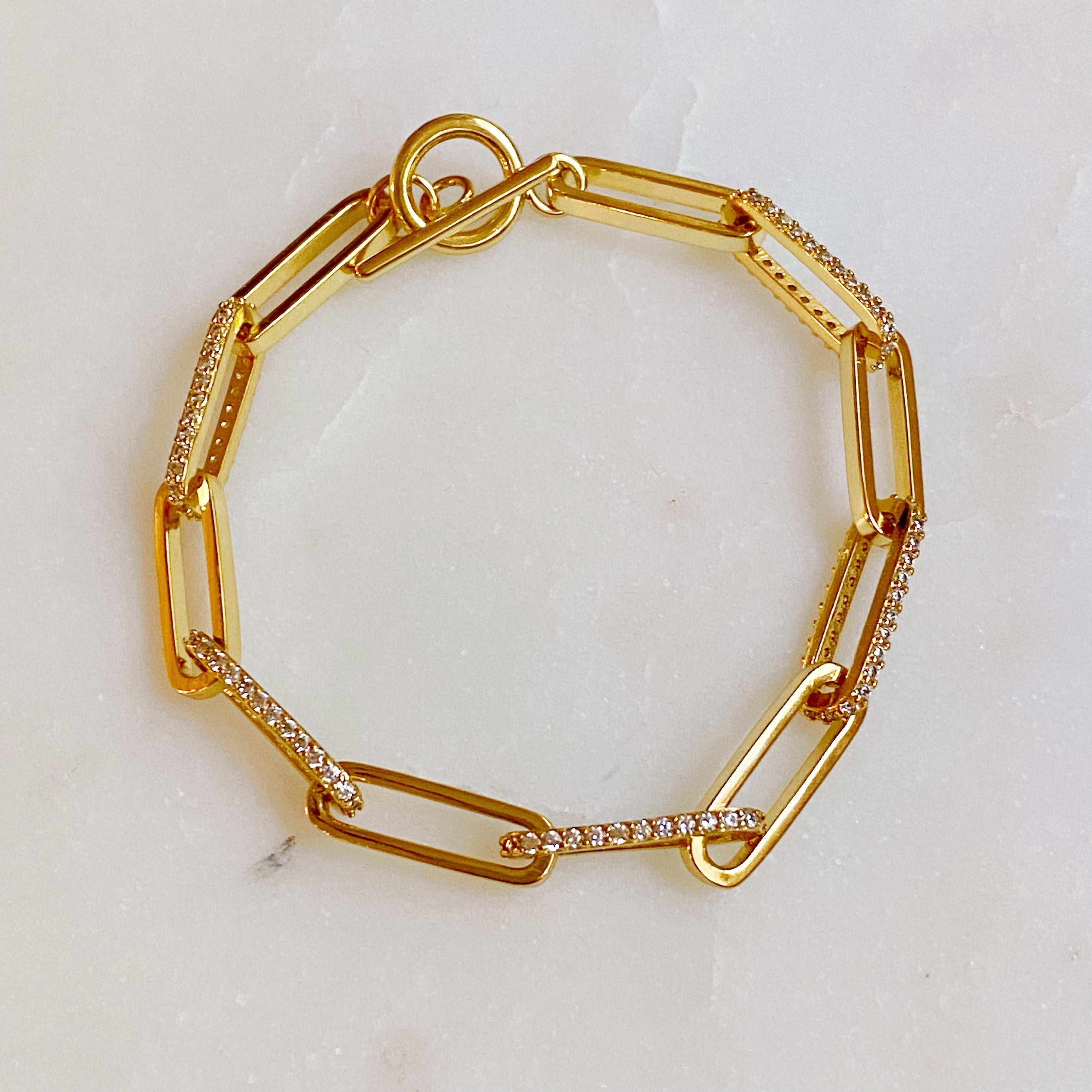 Alternative Shine Link Chain Bracelet featuring alternating sparkly and plain links, crafted from gold plated brass with cubic zirconia accents.