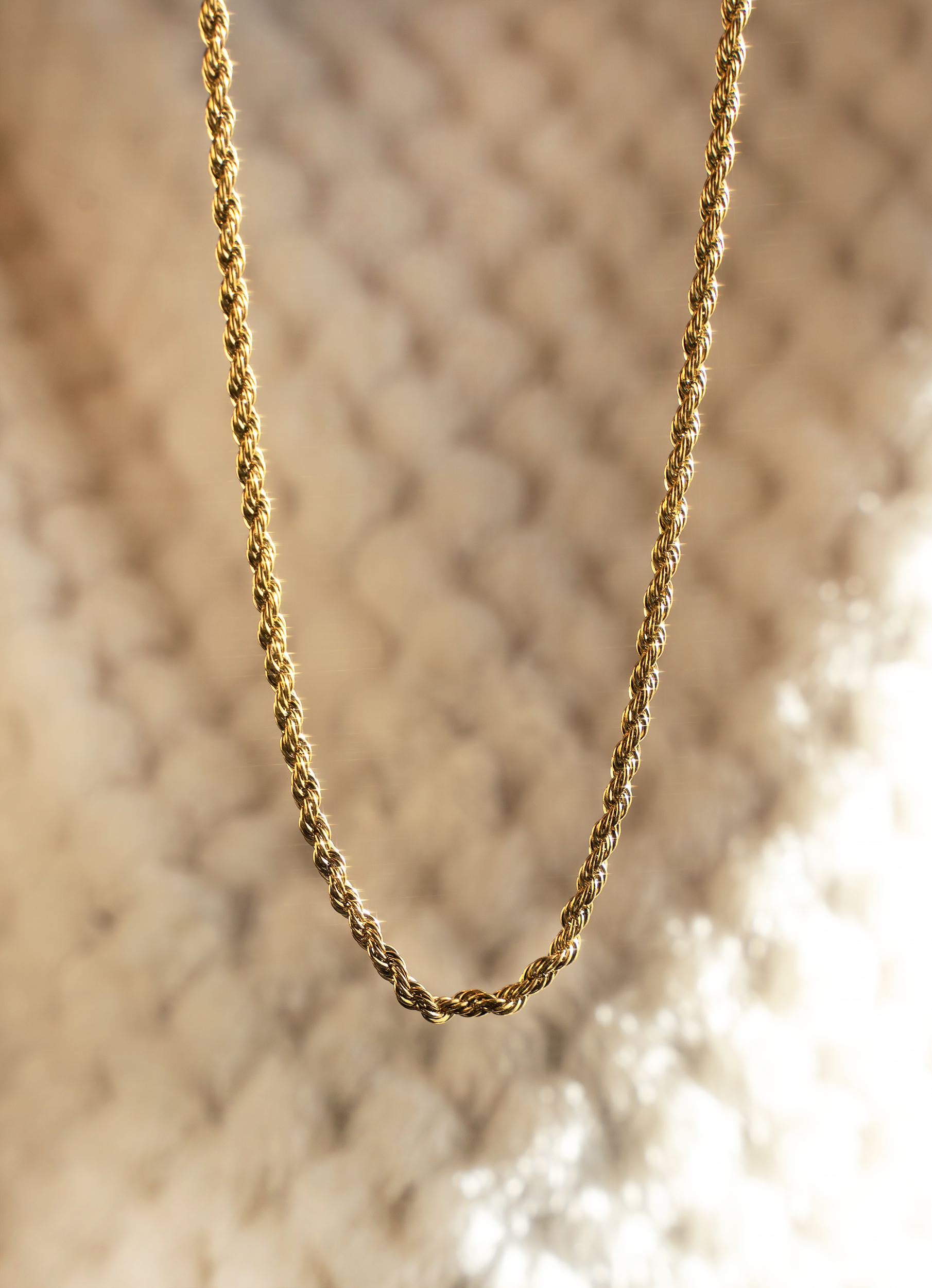 AMMA Rope Chain featuring twisted design, 18k gold plating, and cz stones, perfect for layering or solo wear.