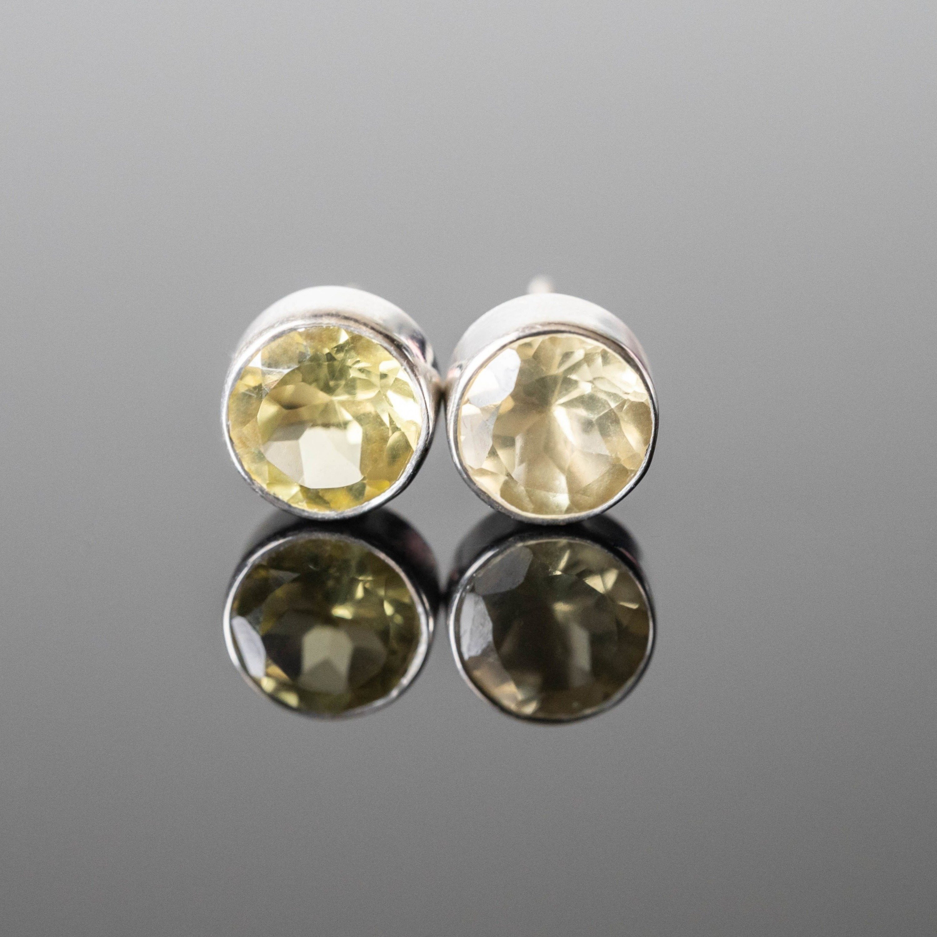 Amalia Lemon Quartz Round Studs featuring yellow lemon quartz stones set in 925 sterling silver with rhodium plating.