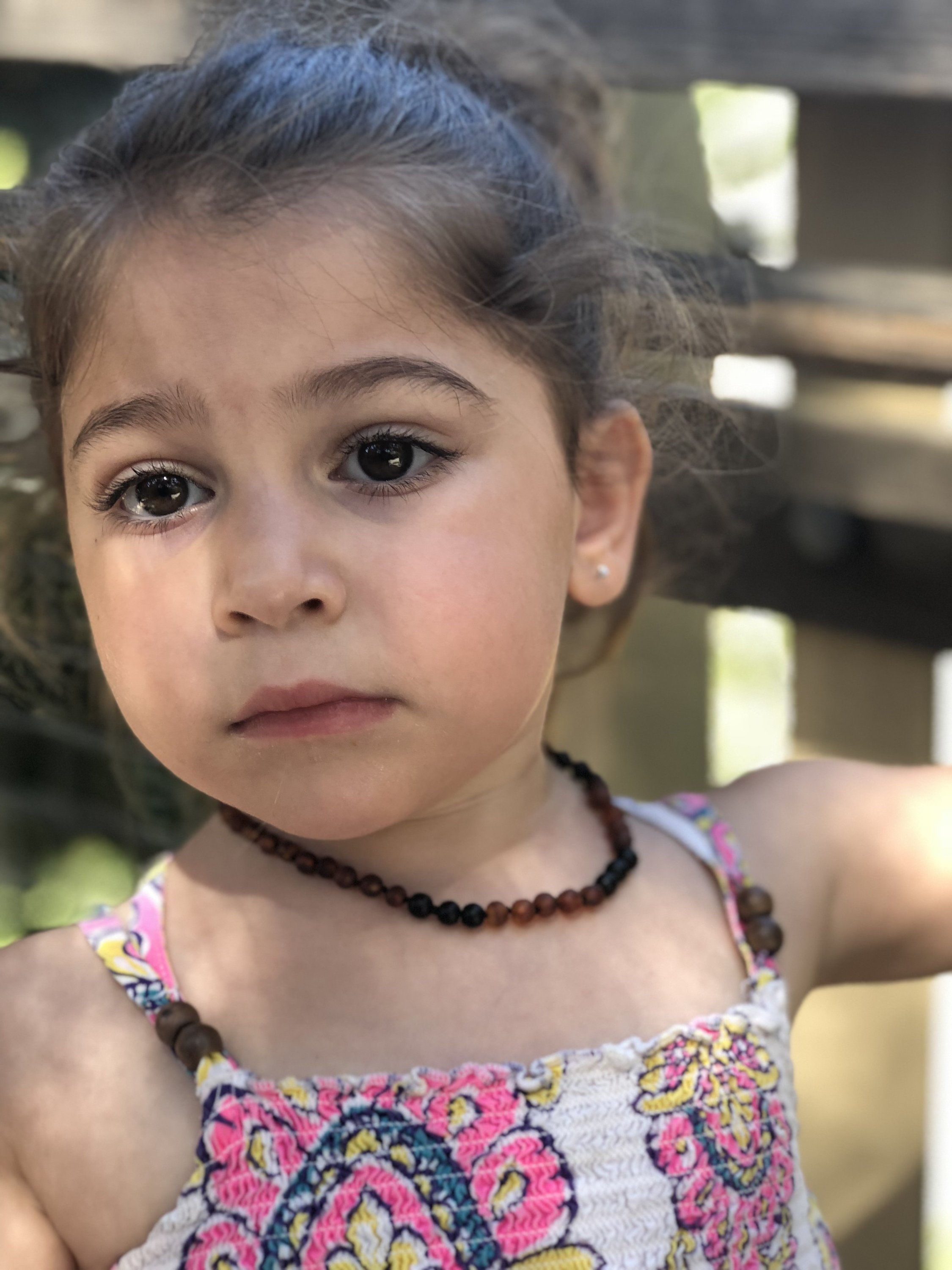 Amber and Shungite necklace designed for babies, featuring individually knotted beads for safety and natural radiation protection.