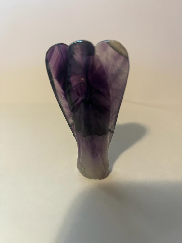 A beautifully hand-carved 3-inch Amethyst Angel figurine showcasing intricate details and natural crystal patterns.