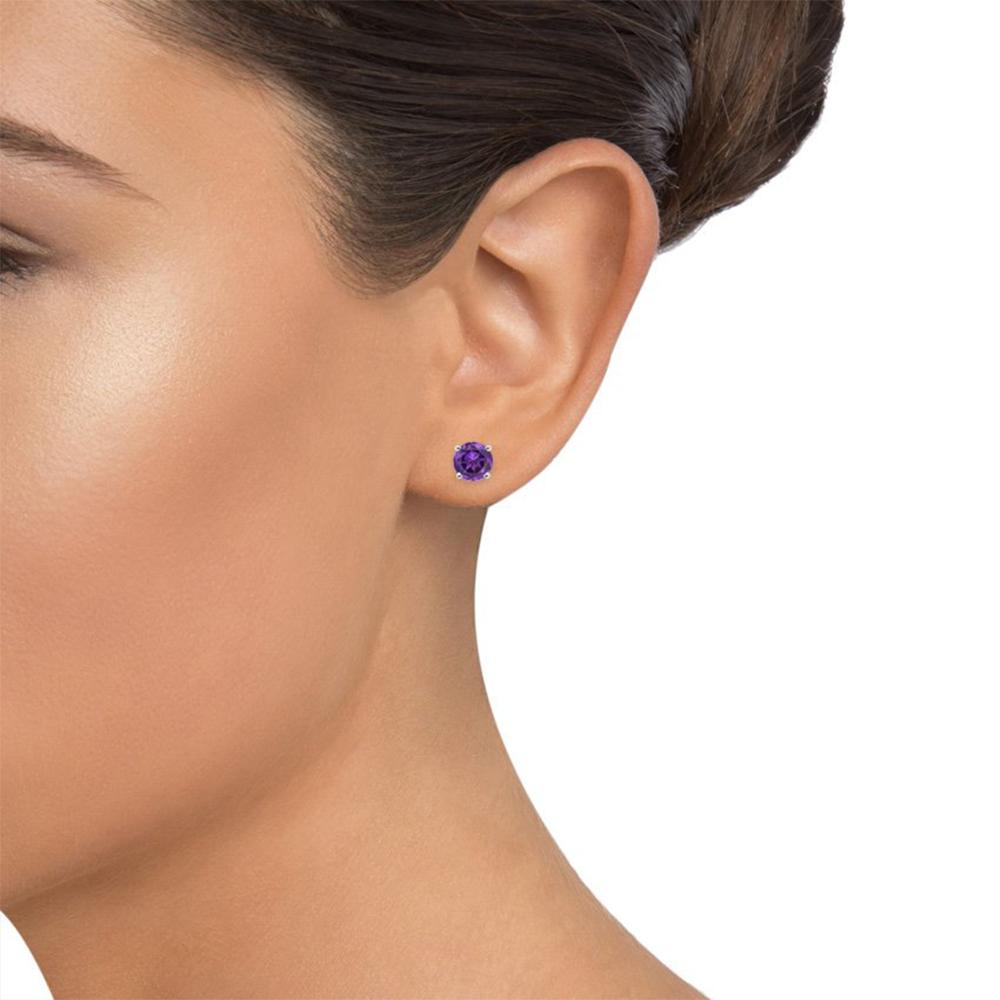 Elegant 6mm Amethyst Created Austrian Crystal stud earrings set in 14K white gold plating, showcasing their vibrant purple hue and luxurious design.