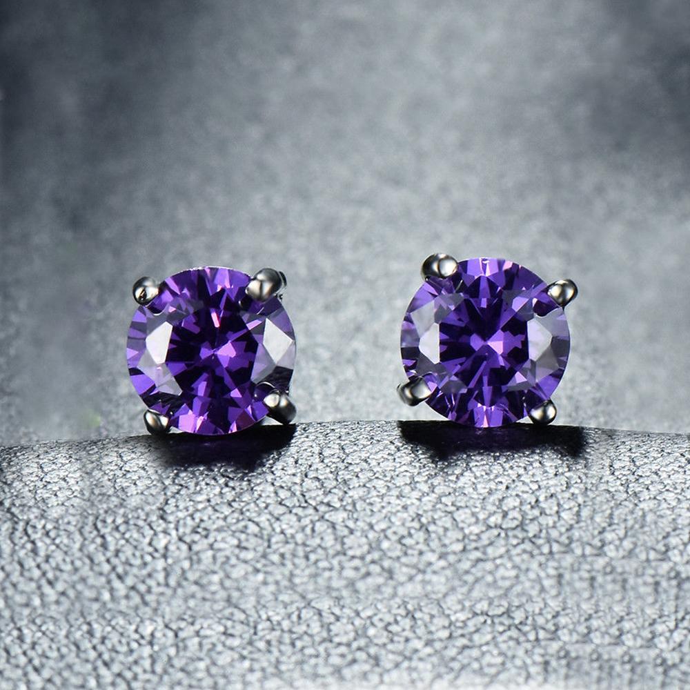 Elegant 6mm Amethyst Created Austrian Crystal stud earrings set in 14K white gold plating, showcasing their vibrant purple hue and luxurious design.