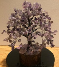 A beautifully crafted Amethyst Gemstone Tree made of 500 natural amethyst chips on silver wire, standing 9 inches tall.