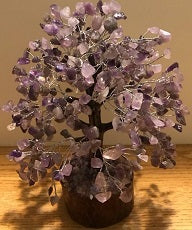 A beautifully crafted Amethyst Gemstone Tree made of 500 natural amethyst chips on silver wire, standing 9 inches tall.