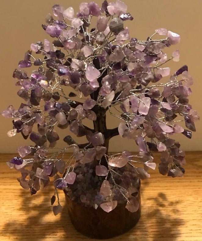 A beautifully crafted Amethyst Gemstone Tree made of 500 natural amethyst chips on silver wire, standing 9 inches tall.