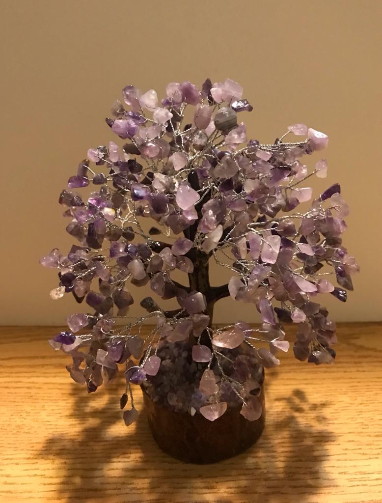 A beautifully crafted Amethyst Gemstone Tree made of 500 natural amethyst chips on silver wire, standing 9 inches tall.