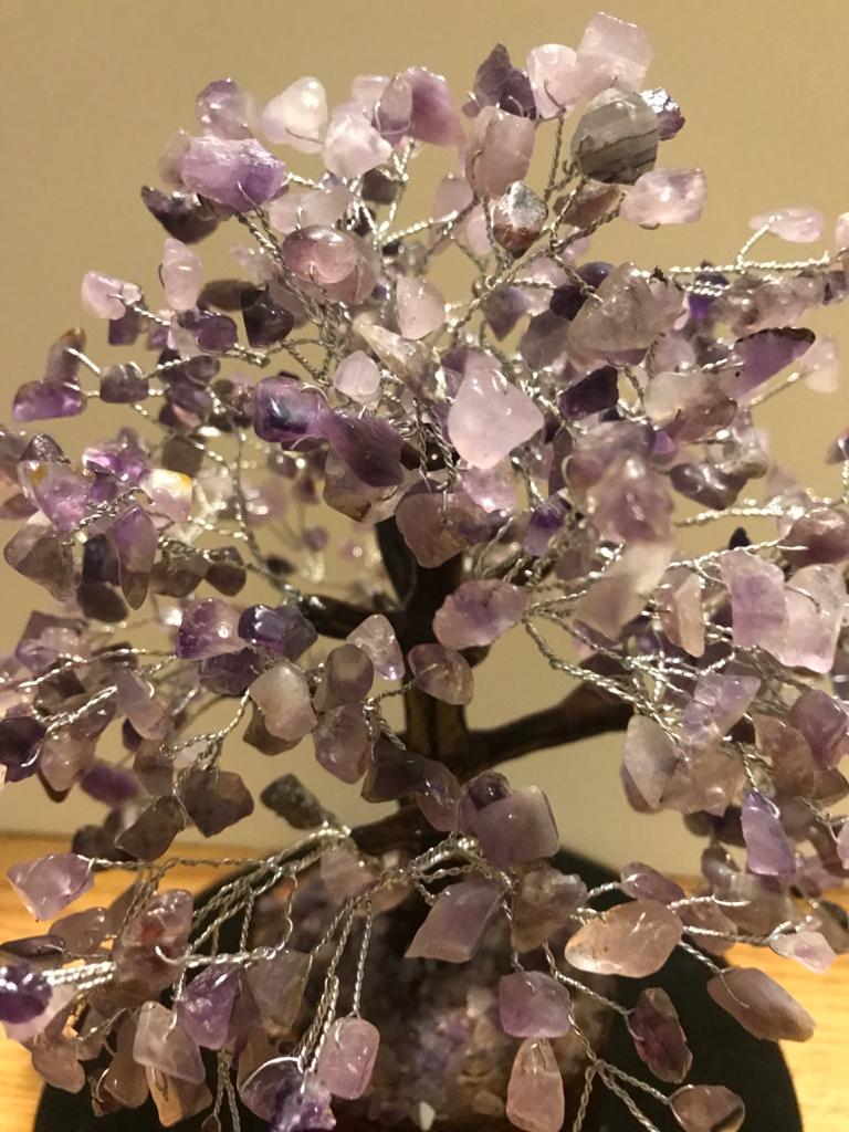 A beautifully crafted Amethyst Gemstone Tree made of 500 natural amethyst chips on silver wire, standing 9 inches tall.