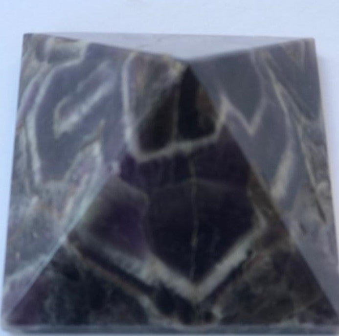 Hand-carved natural Amethyst Pyramid, 3 x 3 inches, showcasing unique color and texture variations.