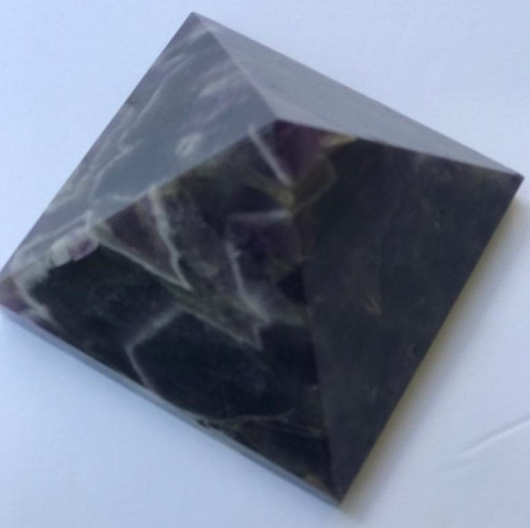 Hand-carved natural Amethyst Pyramid, 3 x 3 inches, showcasing unique color and texture variations.