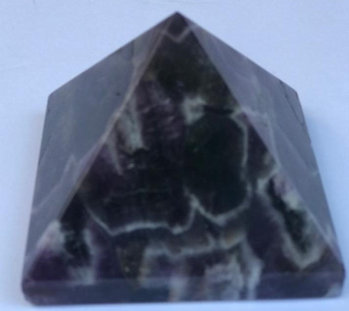 Hand-carved natural Amethyst Pyramid, 3 x 3 inches, showcasing unique color and texture variations.