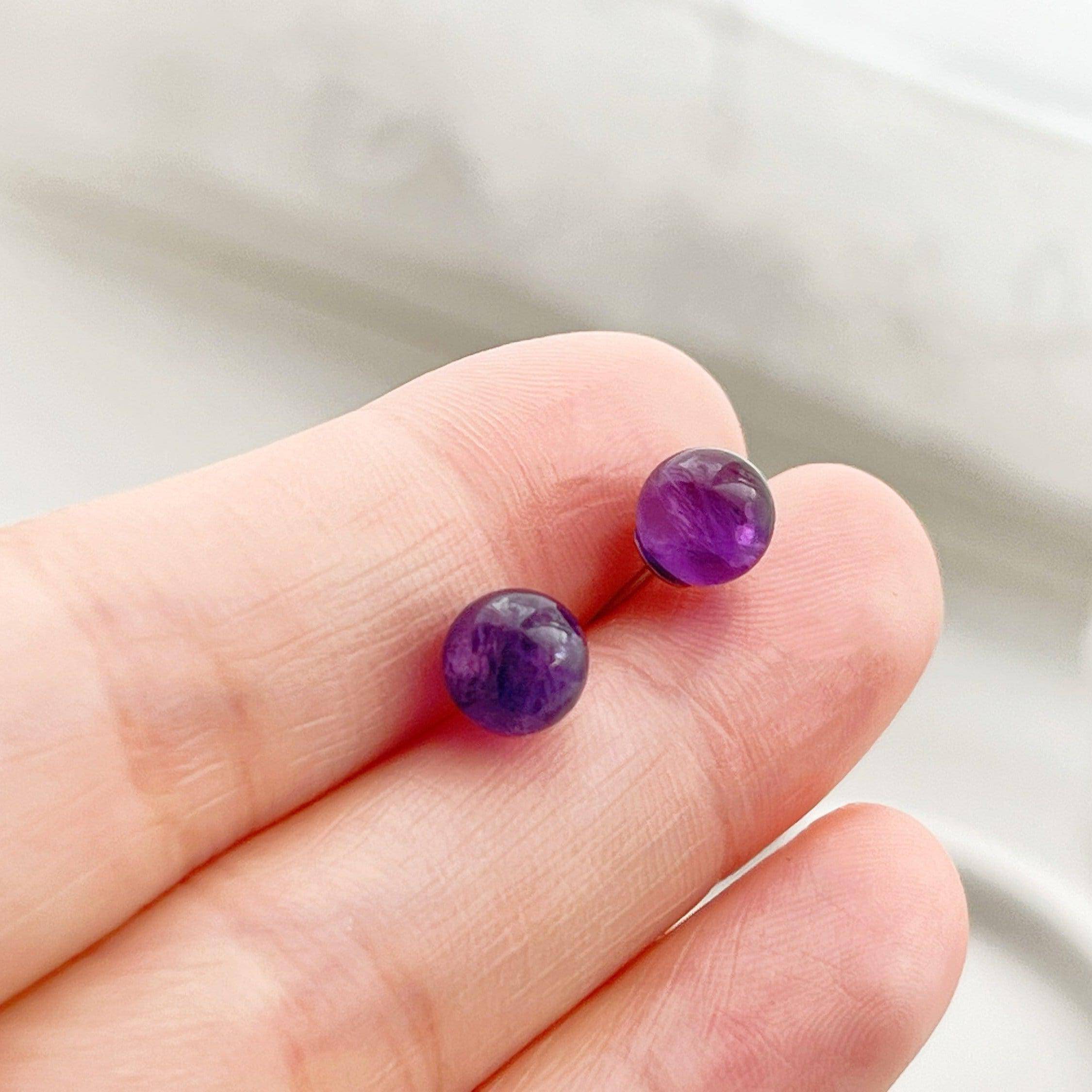 Elegant Amethyst Stud Earrings featuring natural purple stones set in sterling silver, perfect for gifting.