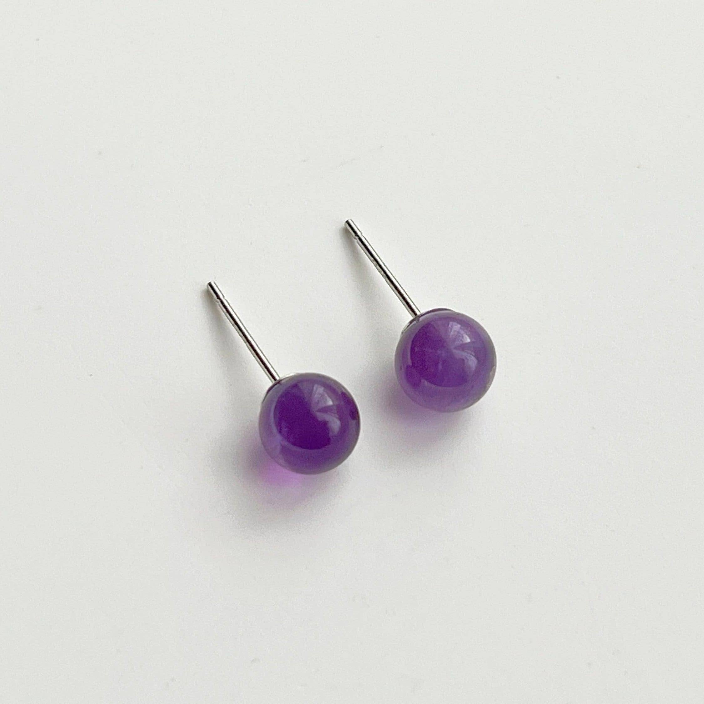 Elegant Amethyst Stud Earrings featuring natural purple stones set in sterling silver, perfect for gifting.