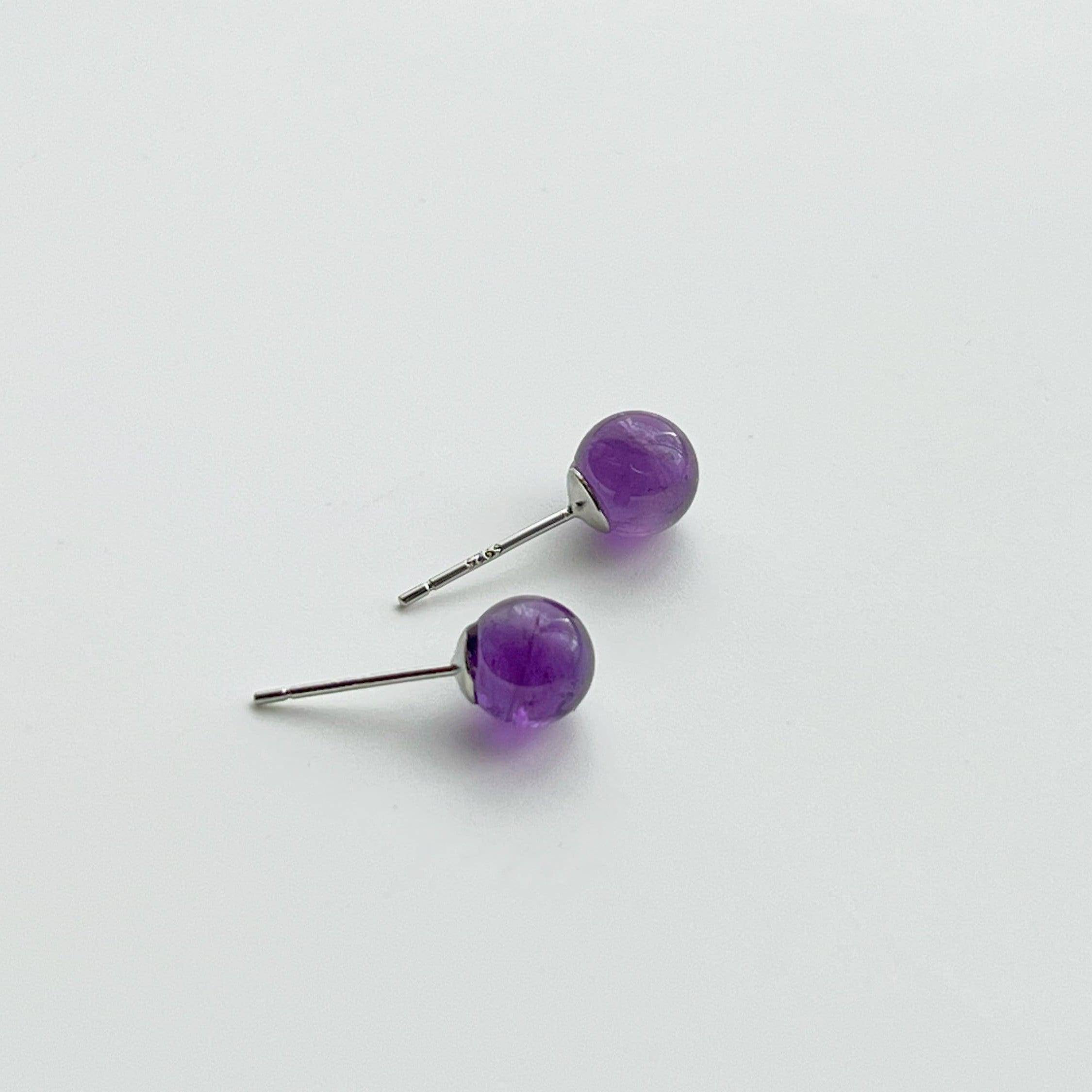 Elegant Amethyst Stud Earrings featuring natural purple stones set in sterling silver, perfect for gifting.