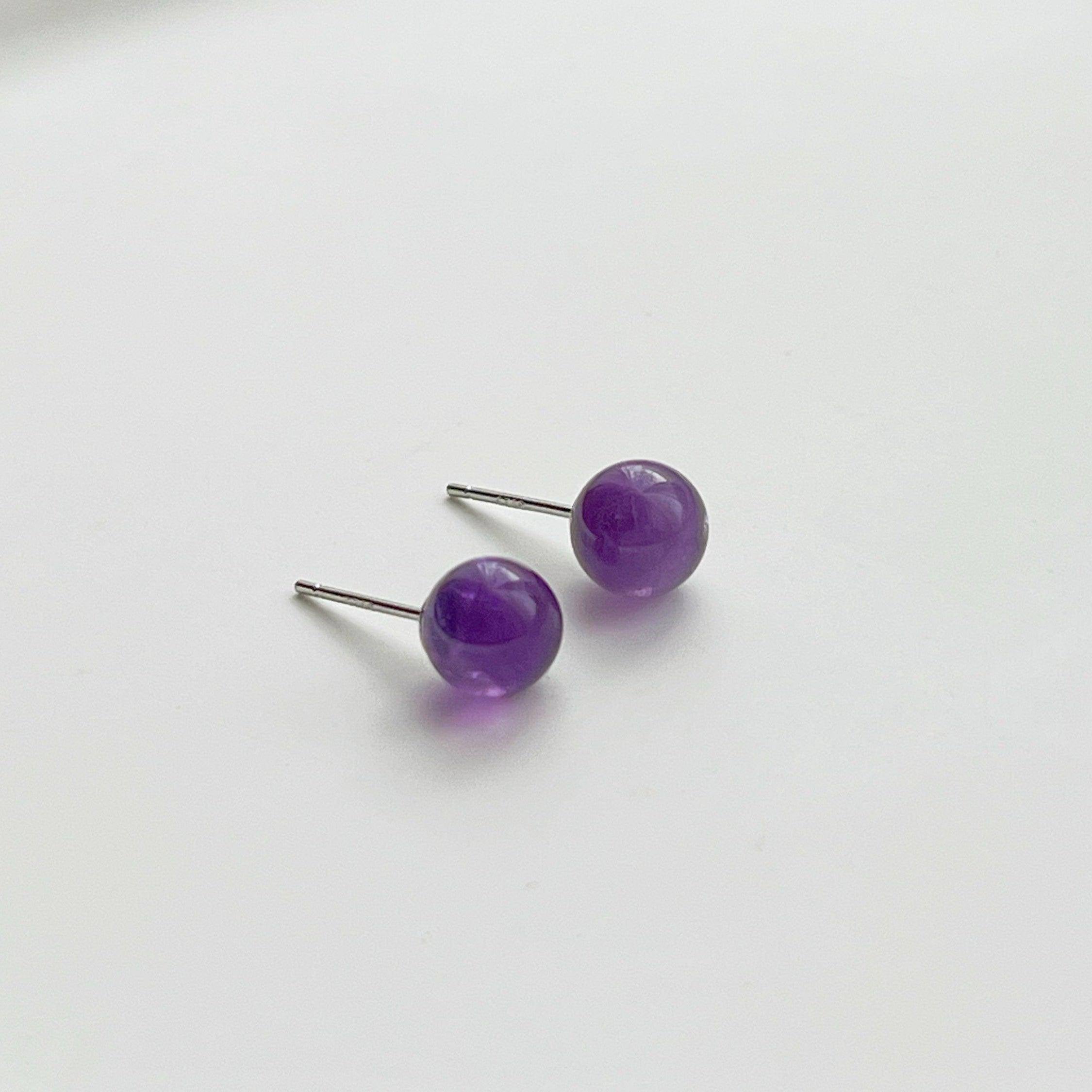 Elegant Amethyst Stud Earrings featuring natural purple stones set in sterling silver, perfect for gifting.