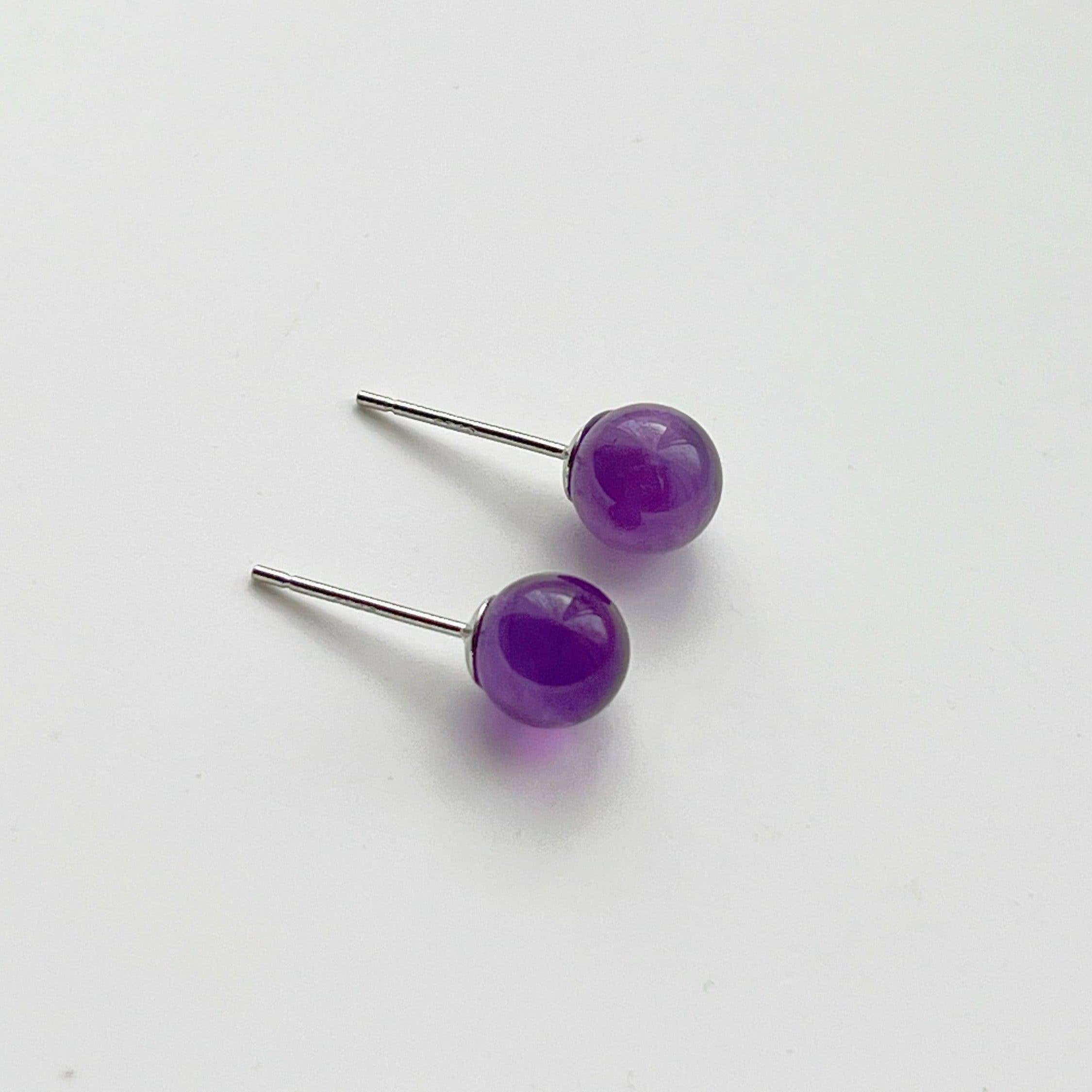 Elegant Amethyst Stud Earrings featuring natural purple stones set in sterling silver, perfect for gifting.