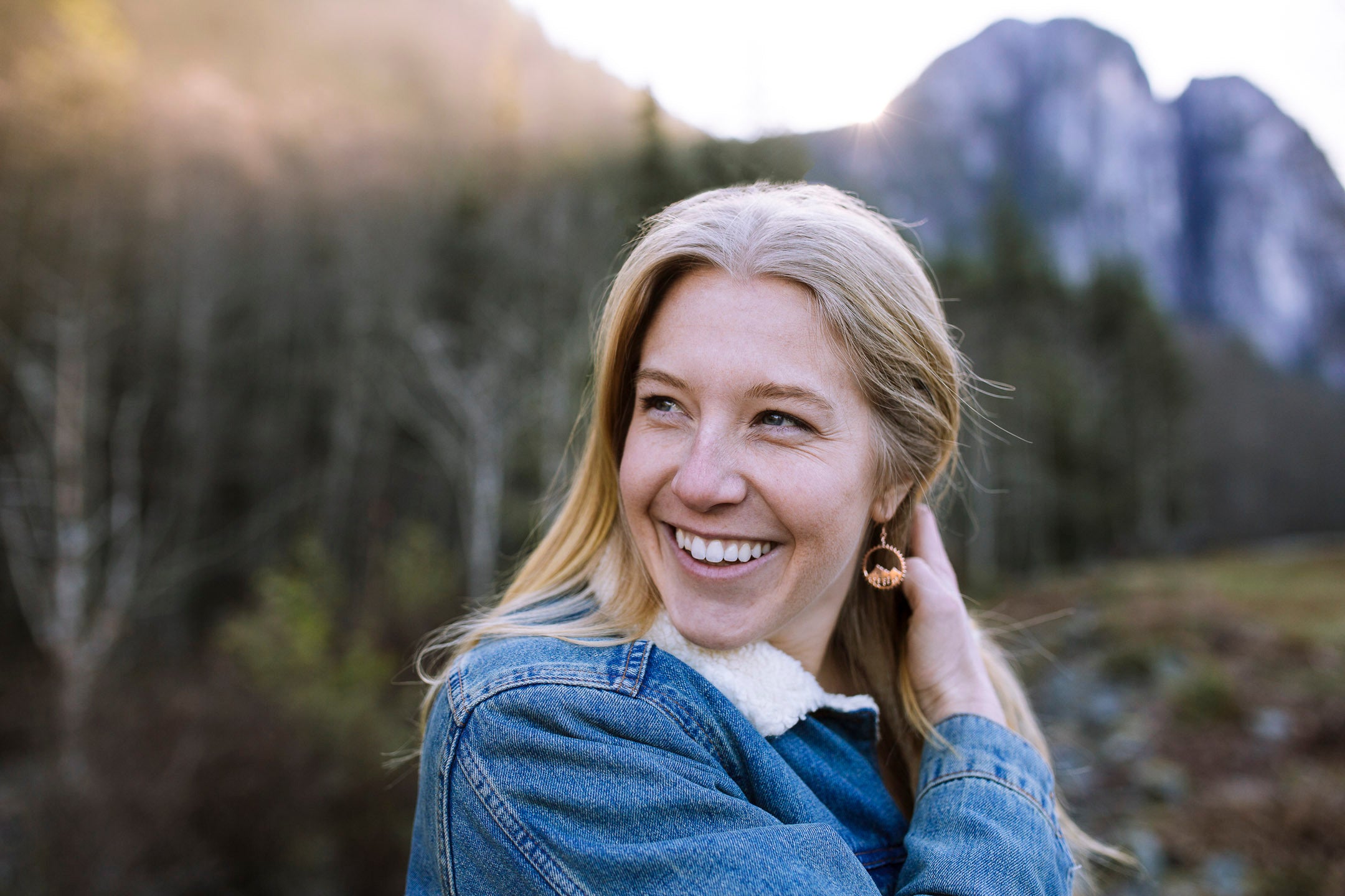 Sterling silver Amore Mountain Earrings featuring a mountainscape design on a chain, with shepherd hooks and silicone backings.