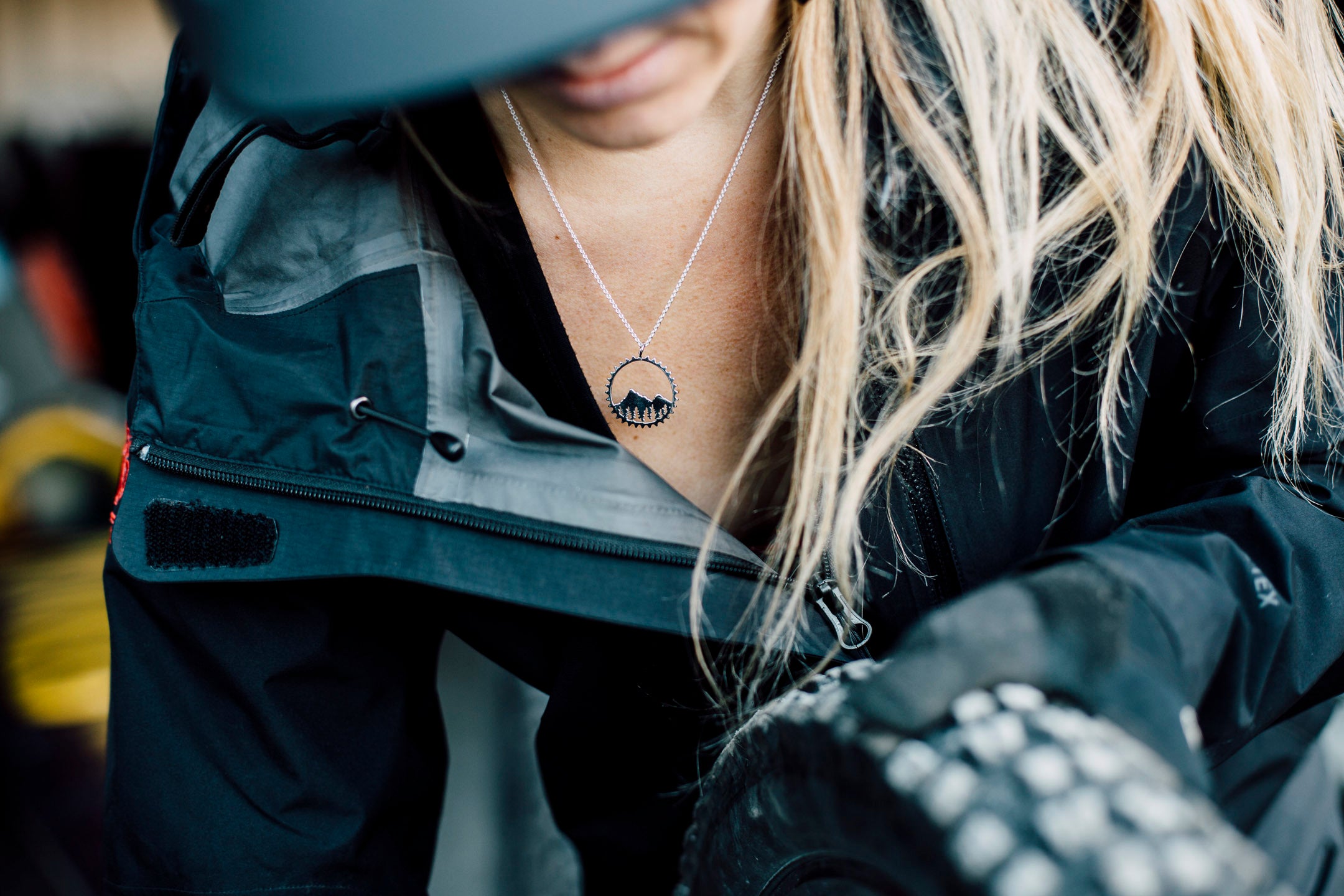 Amore Mountain Necklace featuring a sterling silver mountain design in a chain ring, symbolizing biking adventures.