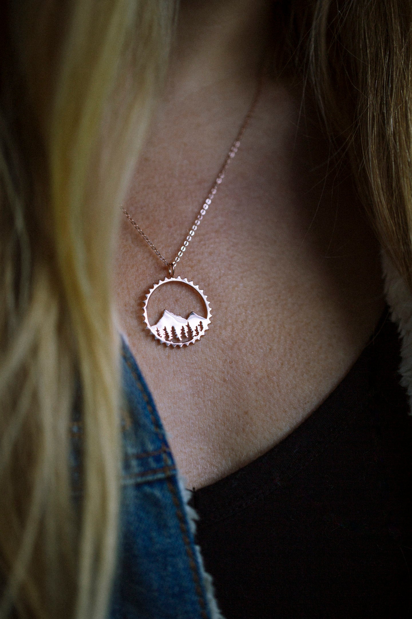 Amore Mountain Necklace featuring a sterling silver mountain design in a chain ring, symbolizing biking adventures.