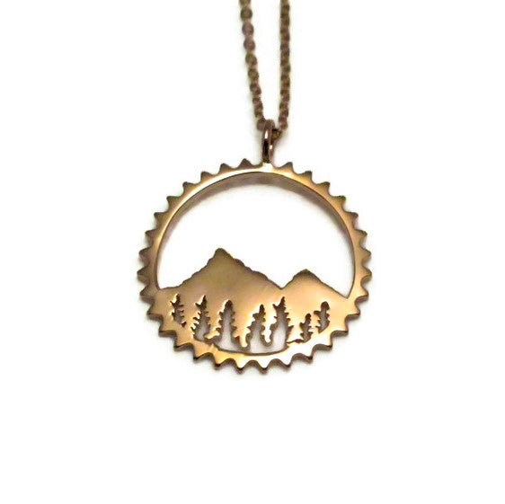 Amore Mountain Necklace featuring a sterling silver mountain design in a chain ring, symbolizing biking adventures.