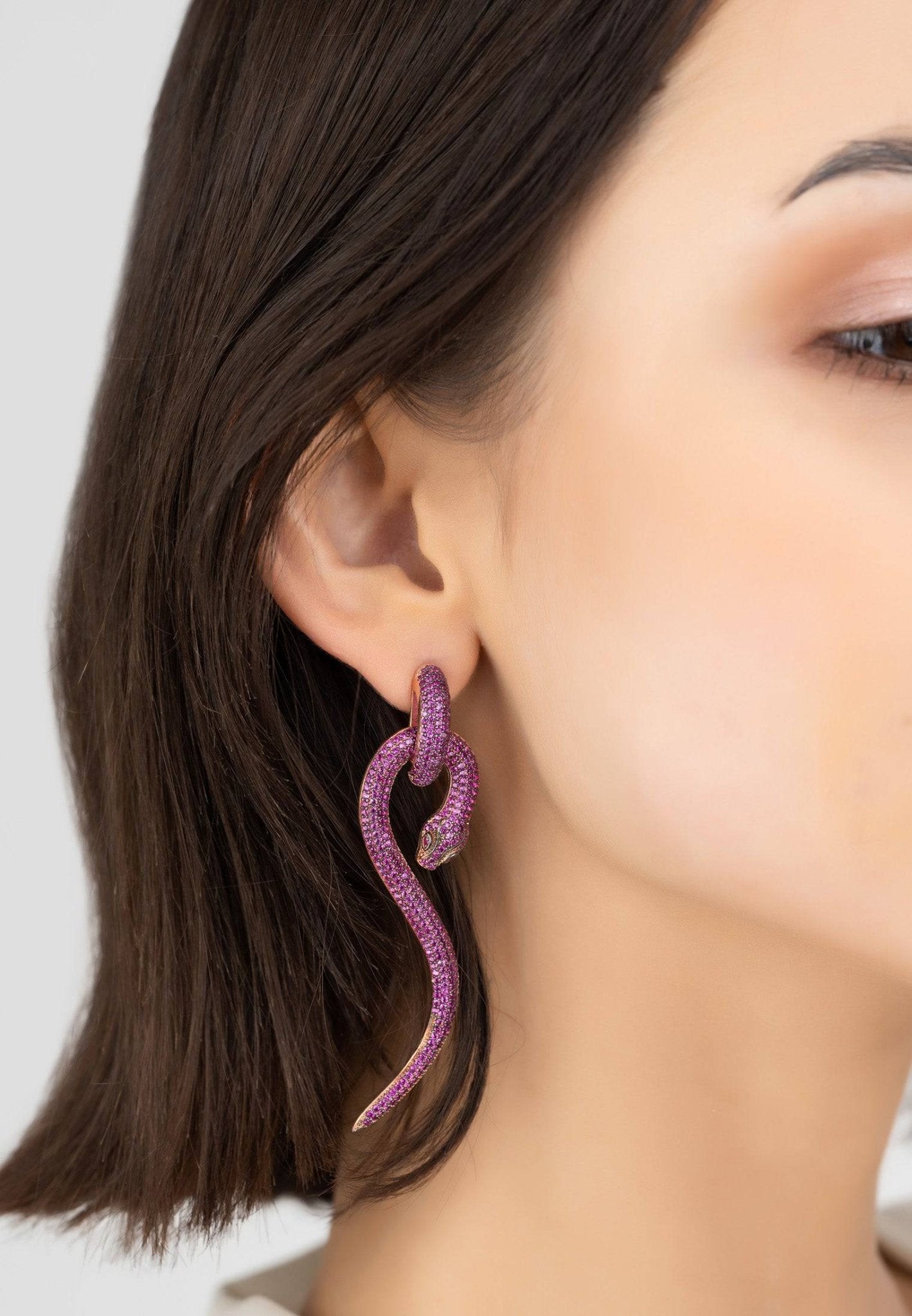 Anaconda Snake Drop Earrings in rosegold featuring ruby cubic zirconia, showcasing a bold snake design.