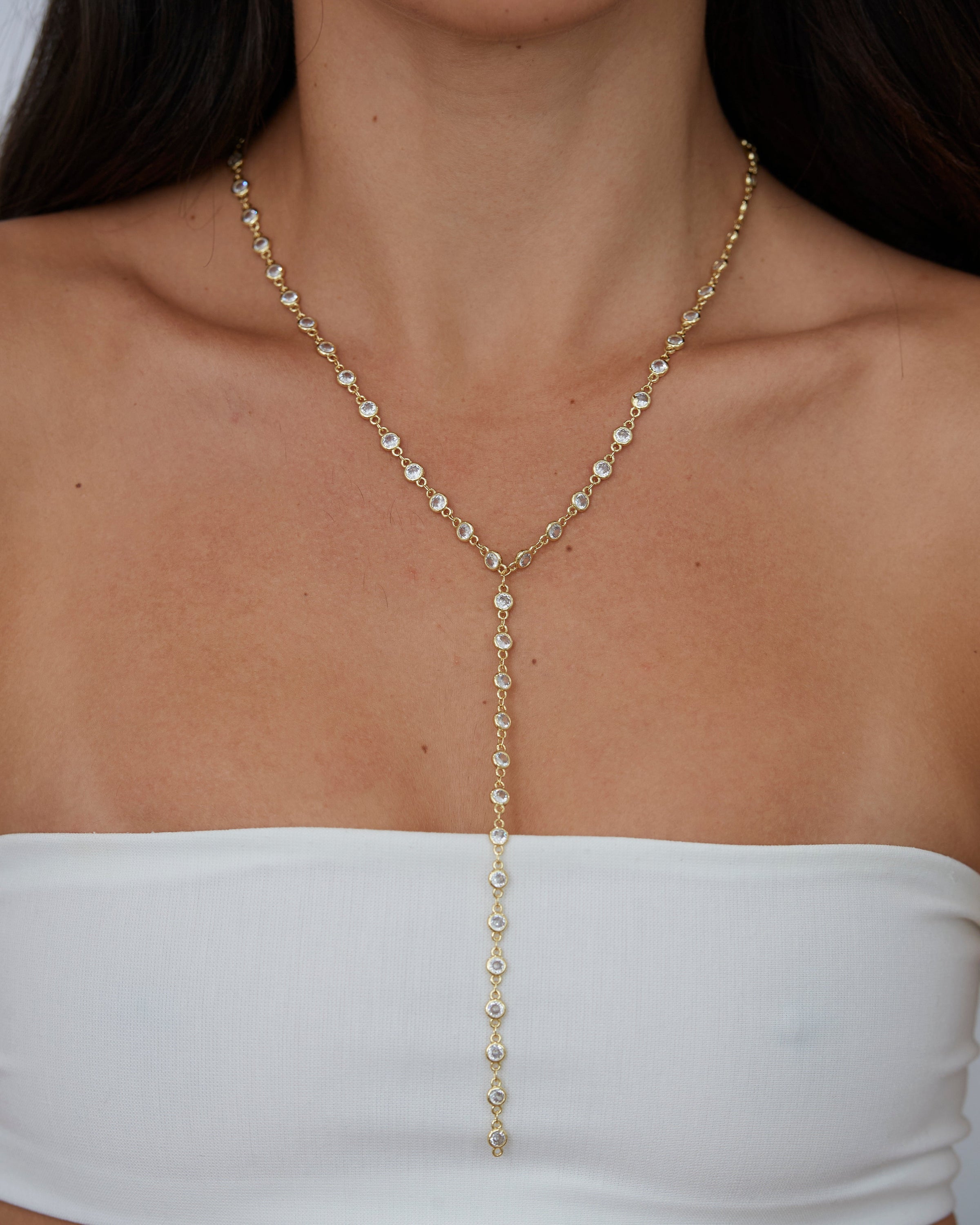 Anastasia Cz Lariat necklace featuring sparkling cz stones and 18k gold plating, elegantly designed for versatile wear.