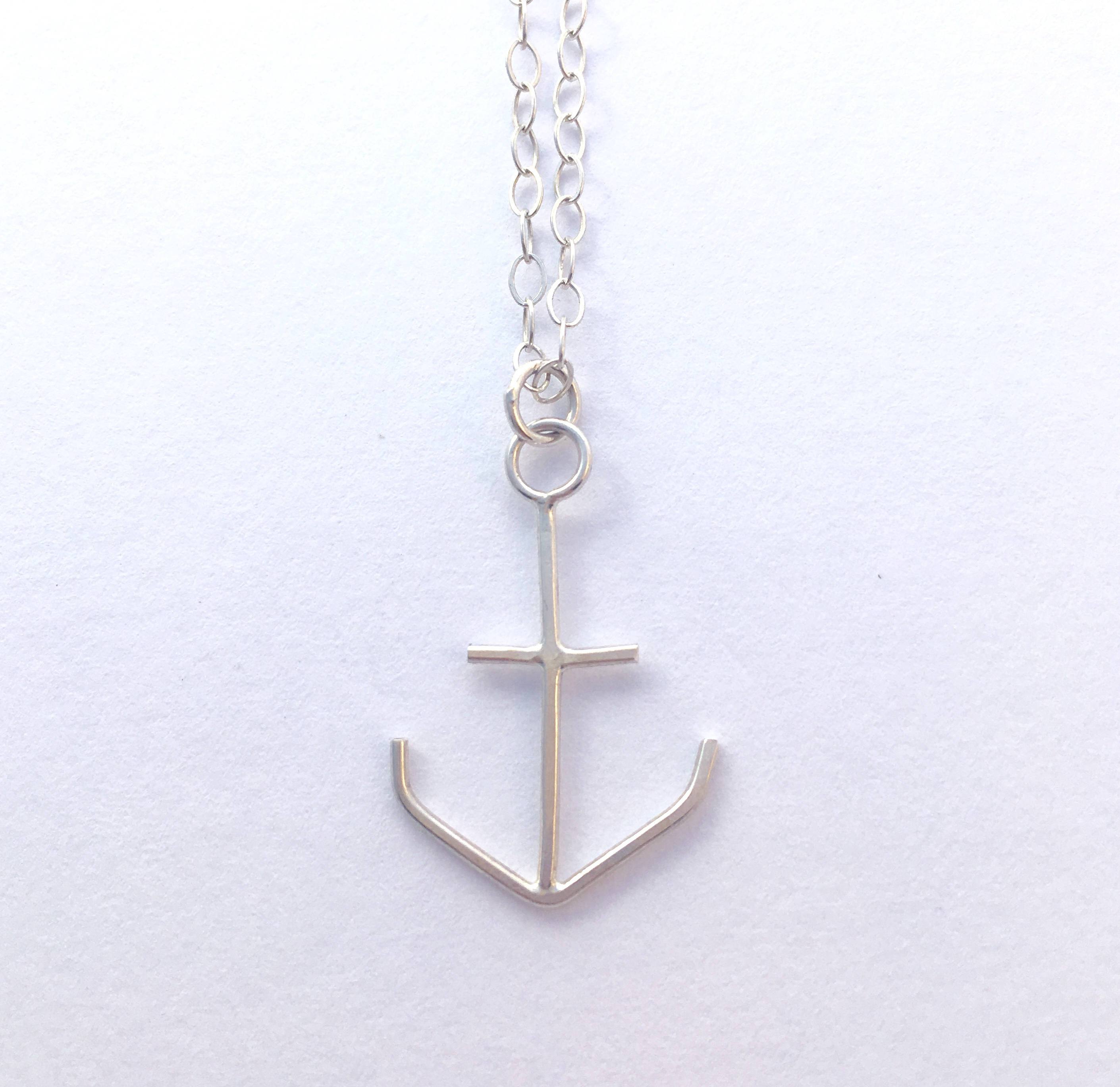 A handcrafted anchor necklace from The Forest & Sea Collection, symbolizing strength and courage, measuring approximately 21x21mm.