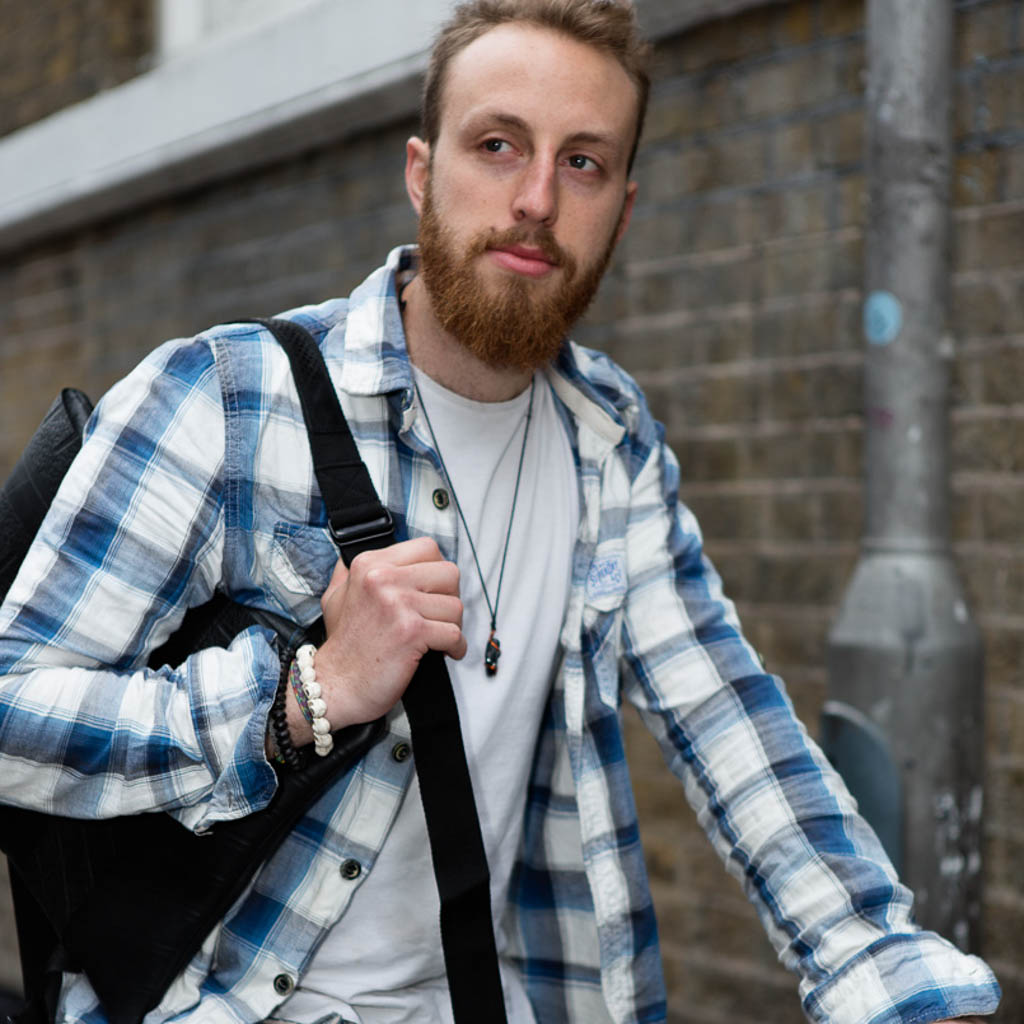 Ando Slimline Inner Tube Vegan Backpack made from recycled rubber, featuring adjustable straps and a button fastening flap.