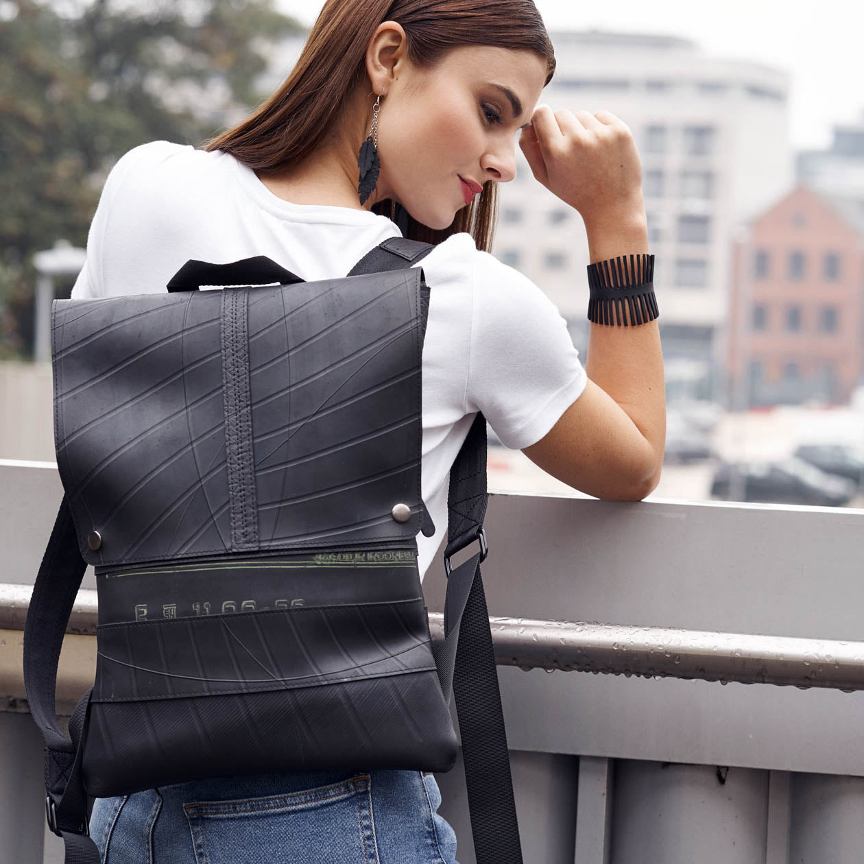 Ando Slimline Inner Tube Vegan Backpack made from recycled rubber, featuring adjustable straps and a button fastening flap.