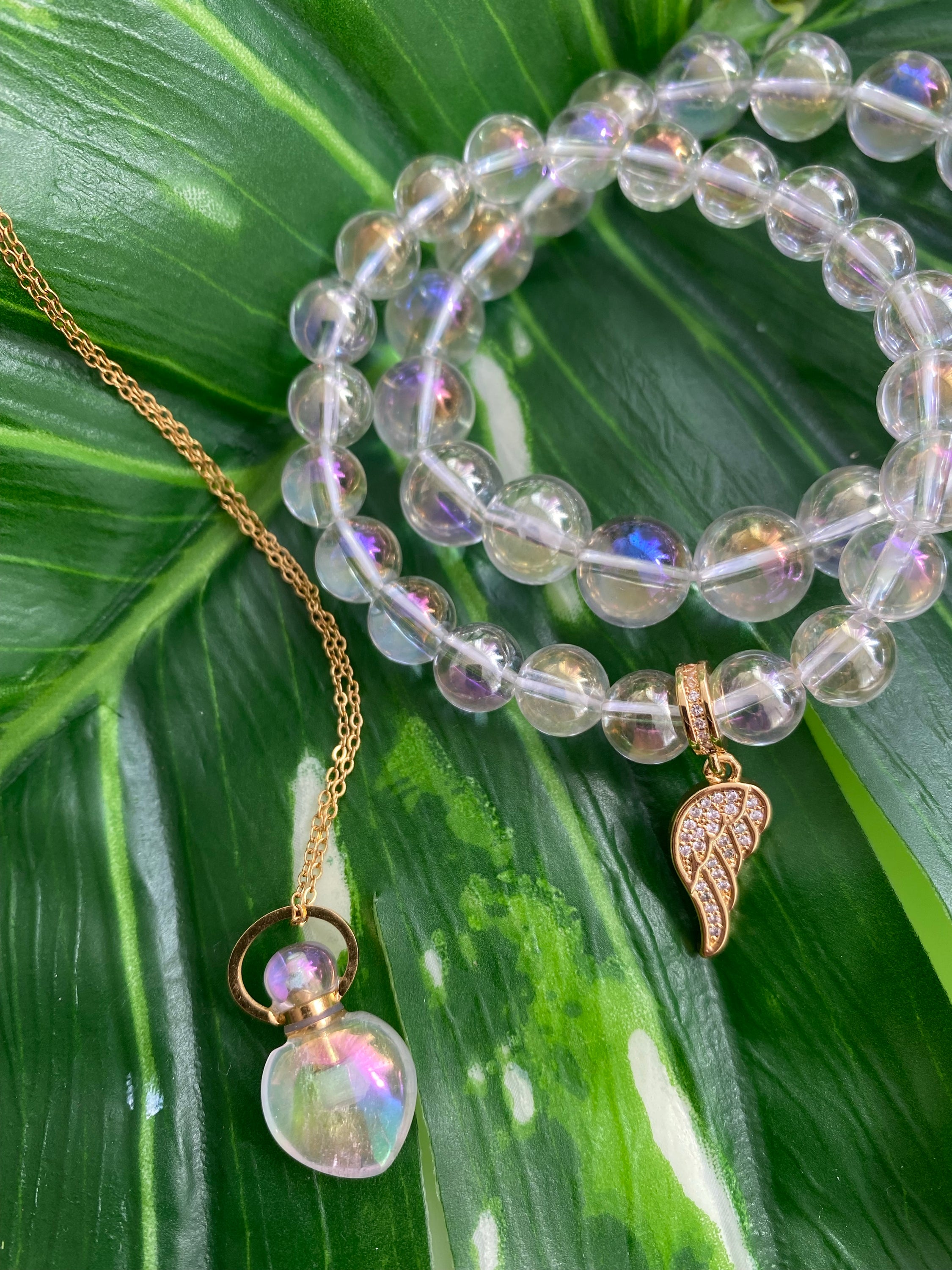 Angel Aura Aroma Gem Necklace featuring a teardrop pendant made of angel aura quartz, designed to hold essential oils.