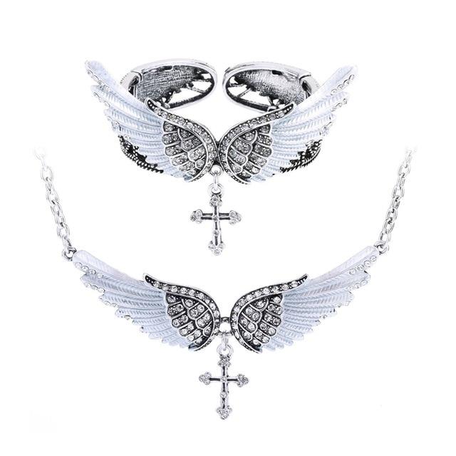 Angel wing cross necklace and bracelet set for women, featuring intricate designs in zinc alloy and crystal accents, perfect for biker jewelry lovers.