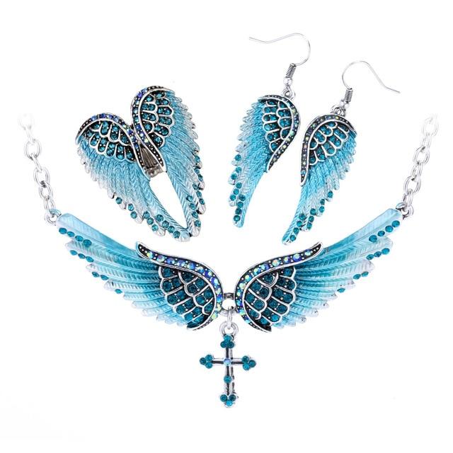 Angel Wing Cross Necklace Earrings Ring Set for women, featuring intricate designs in zinc alloy with crystal accents.