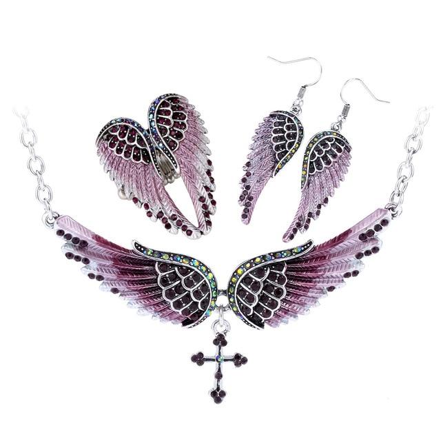 Angel Wing Cross Necklace Earrings Ring Set for women, featuring intricate designs in zinc alloy with crystal accents.