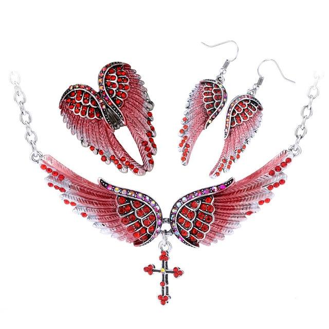 Angel Wing Cross Necklace Earrings Ring Set for women, featuring intricate designs in zinc alloy with crystal accents.