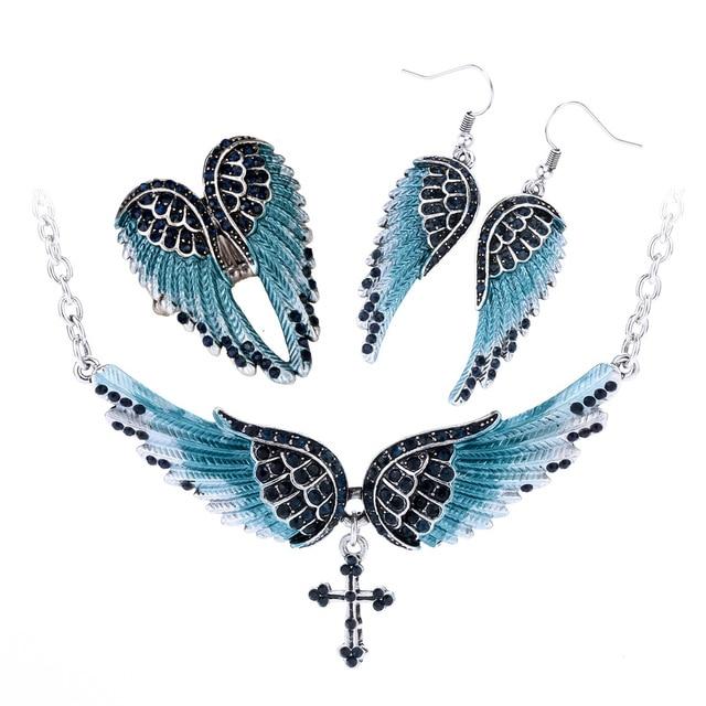 Angel Wing Cross Necklace Earrings Ring Set for women, featuring intricate designs in zinc alloy with crystal accents.