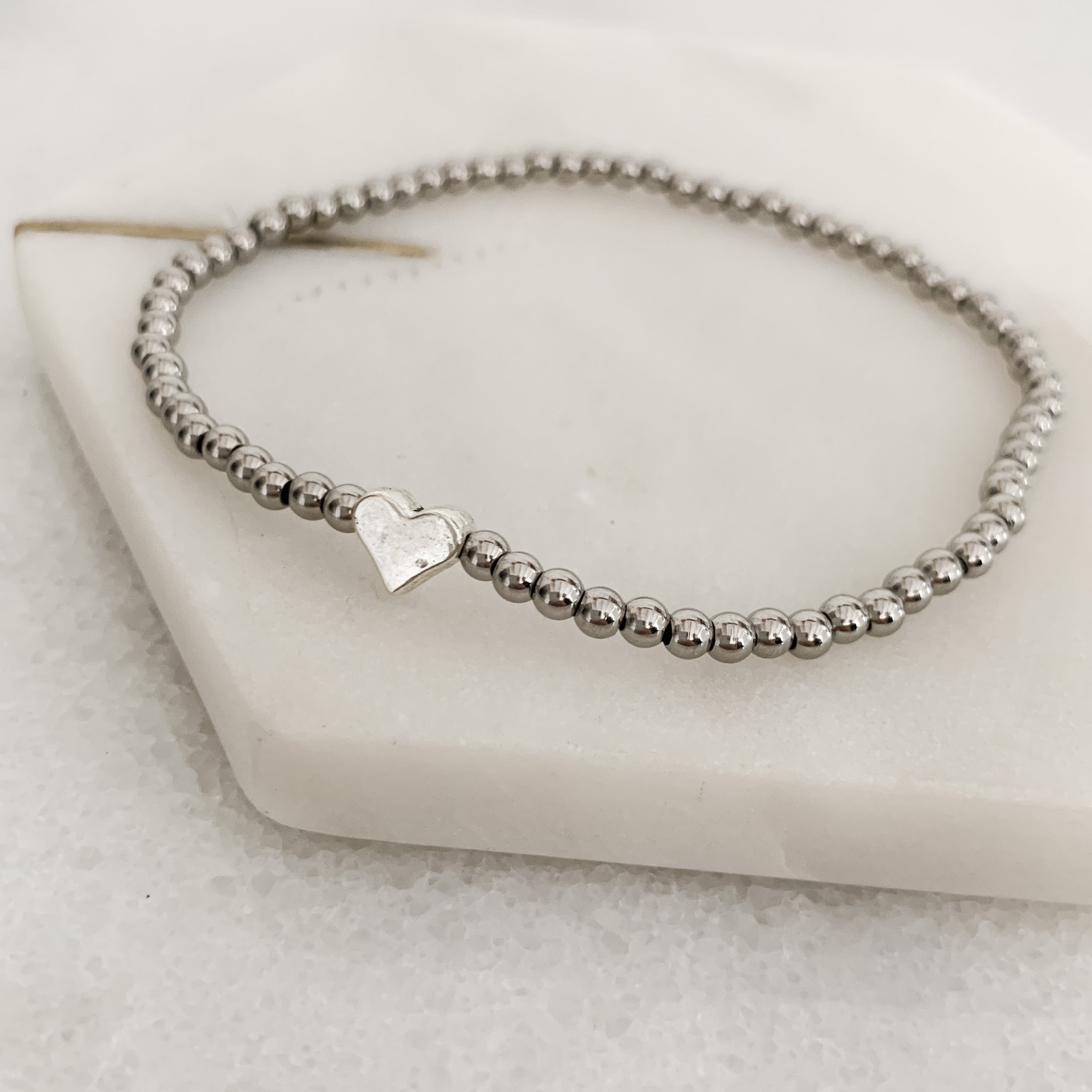 Angels are Near Heart Stretch Bracelet featuring a delicate heart design, handmade with hypoallergenic materials, perfect for everyday wear.