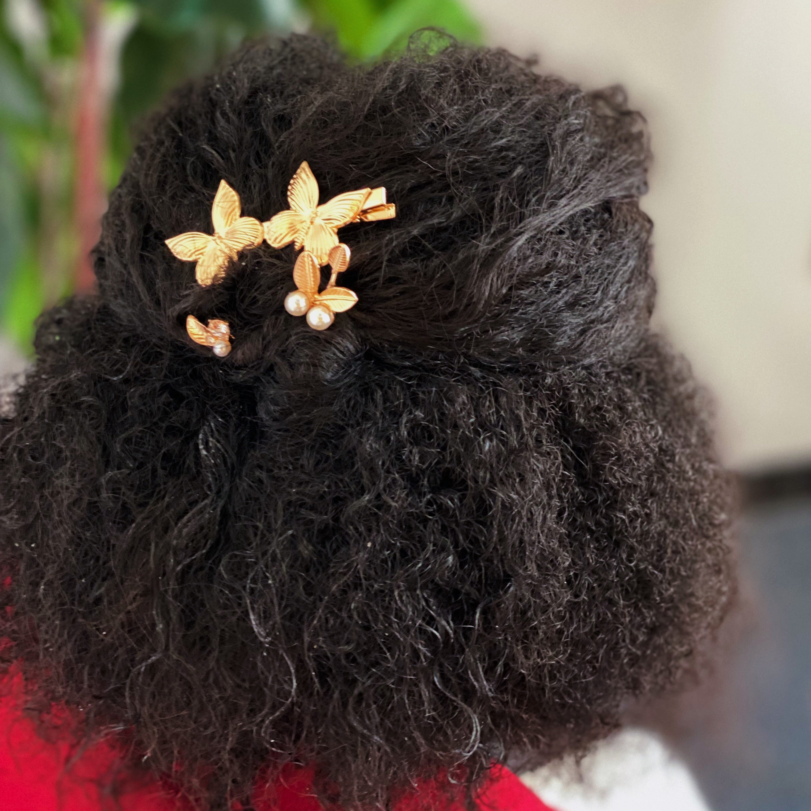 Antique Garden Hair Clip Set featuring two butterfly clips and two elegant pins with a golden finish, showcasing intricate details.