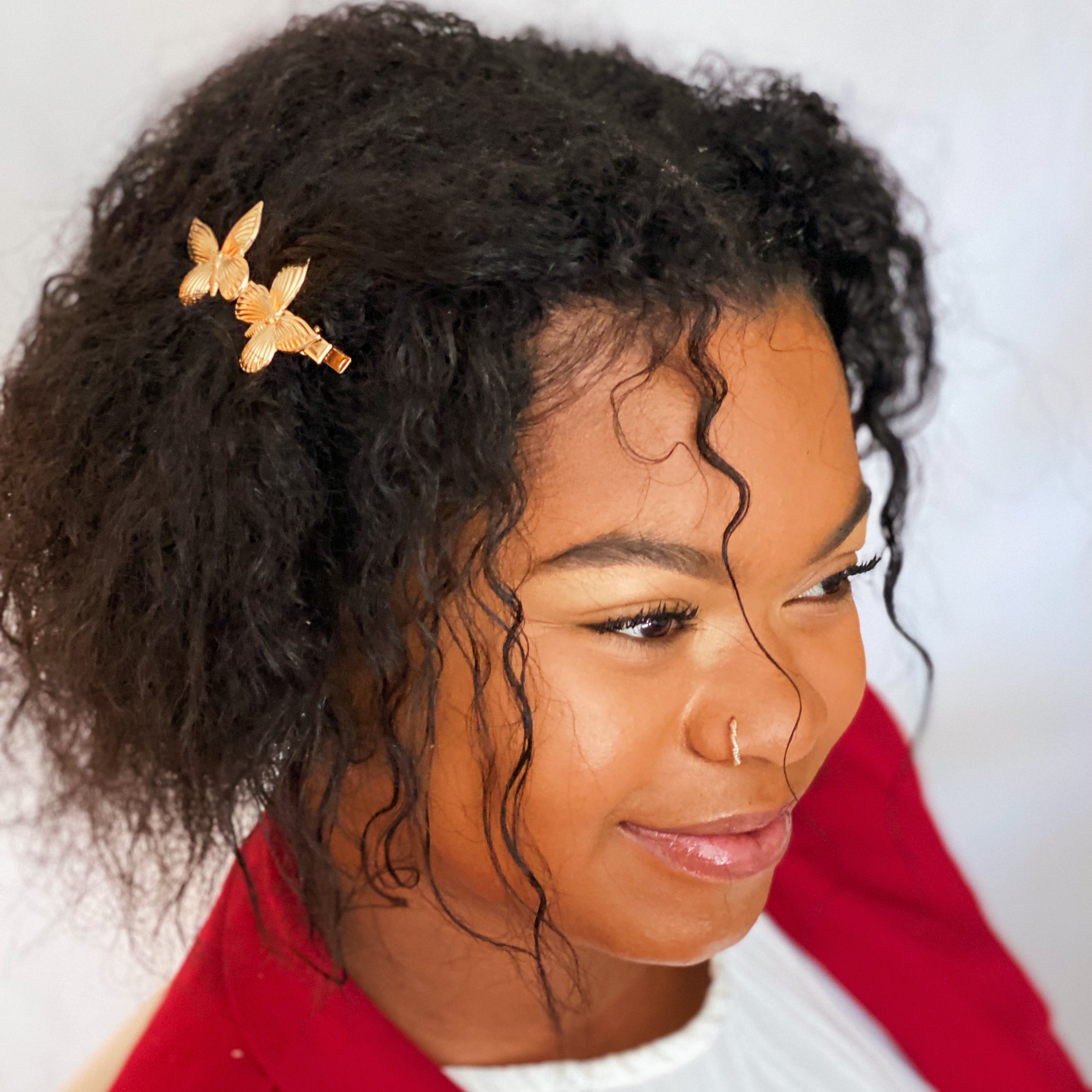 Antique Garden Hair Clip Set featuring two butterfly clips and two elegant pins with a golden finish, showcasing intricate details.