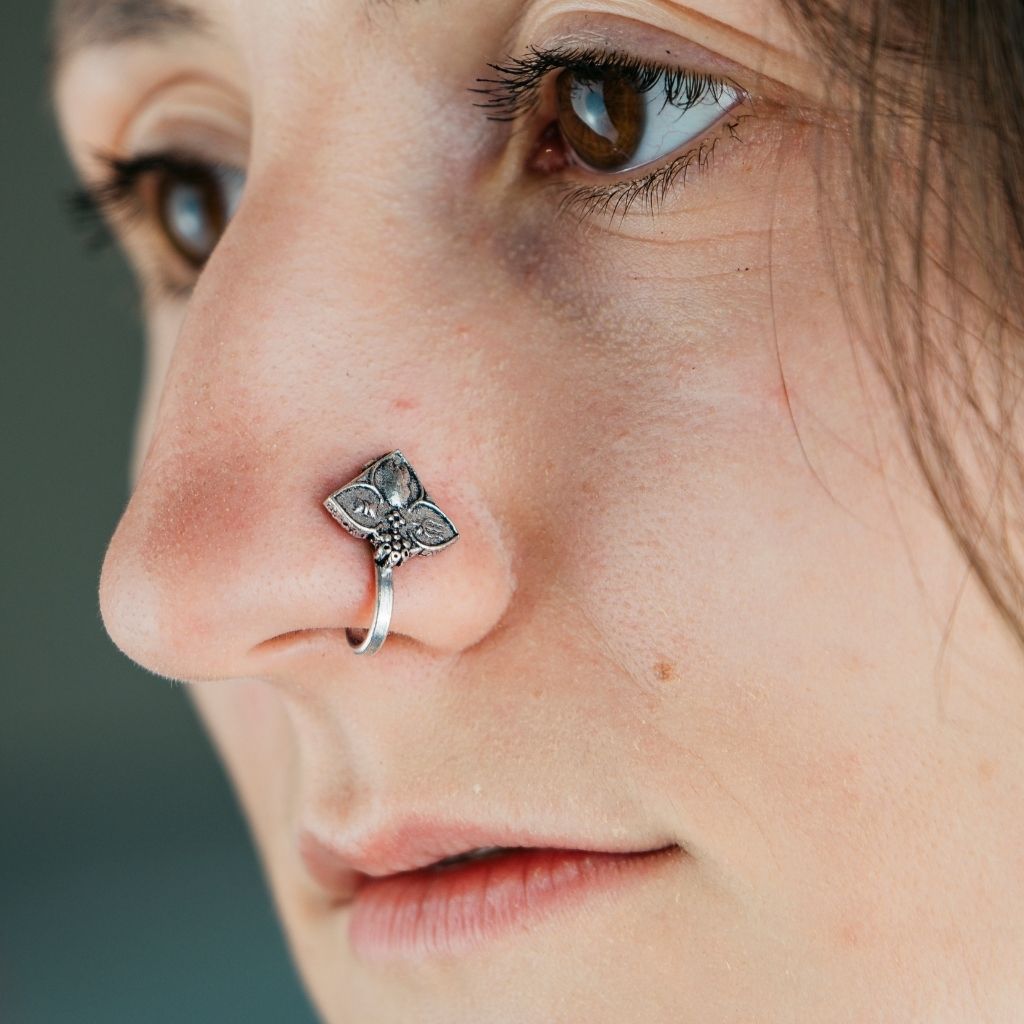 Antique Quality Oxidised German Silver Floral Non Pierced Nose Pin with intricate floral design, showcasing a beautiful silver hue.