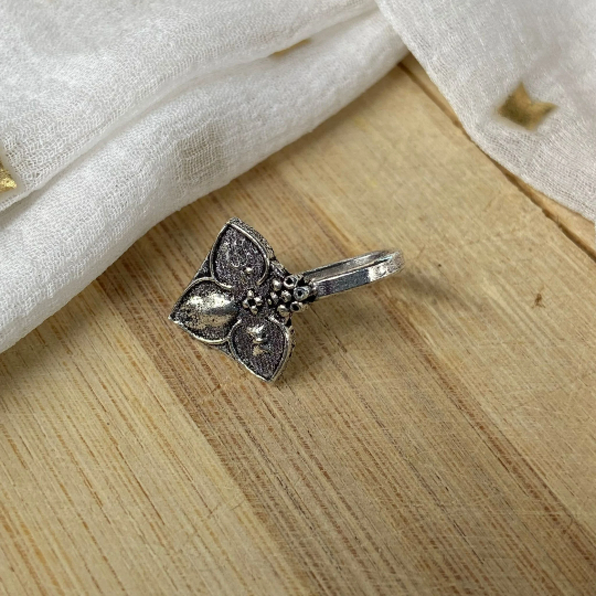 Antique Quality Oxidised German Silver Floral Non Pierced Nose Pin with intricate floral design, showcasing a beautiful silver hue.