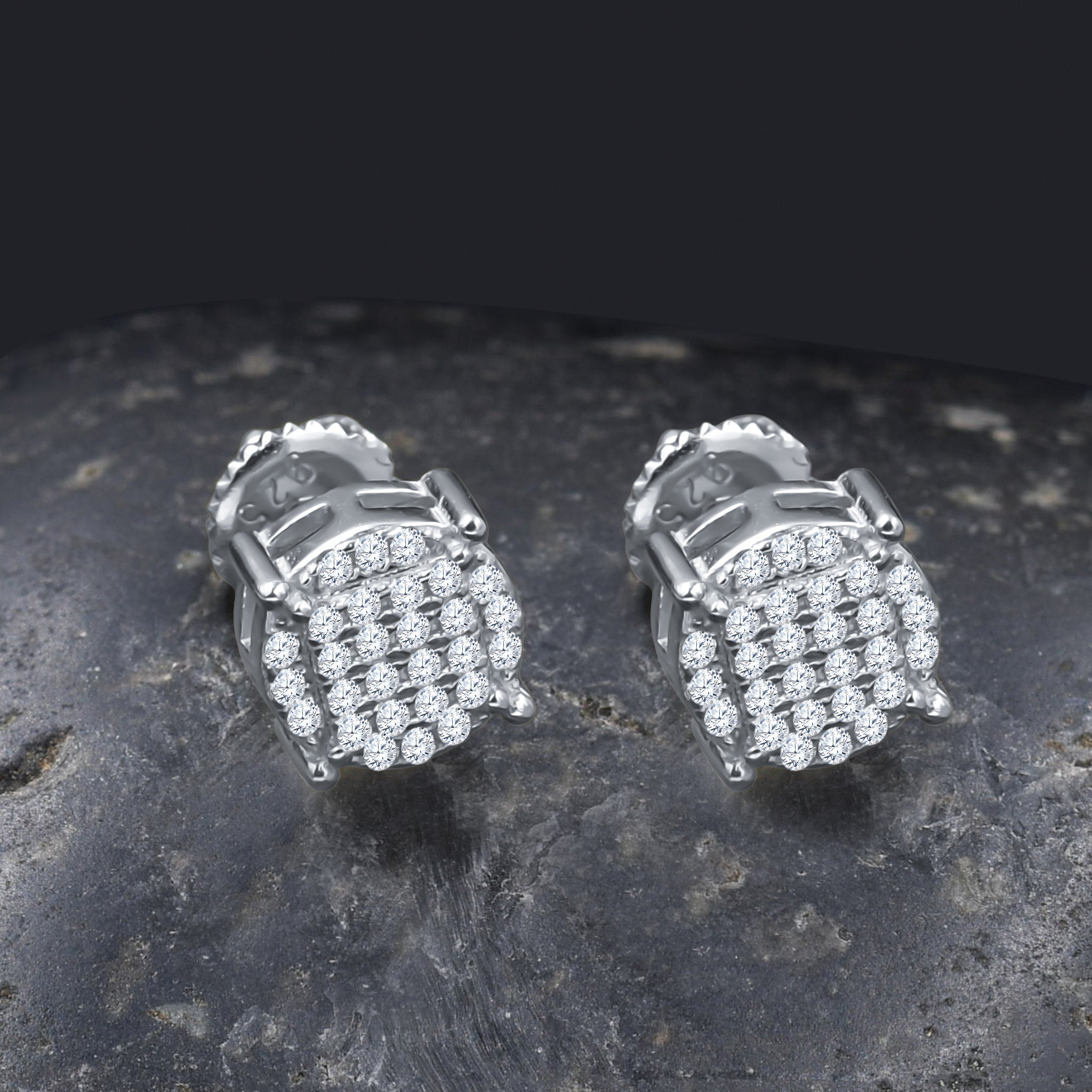 A pair of ANNULAIRE ear studs featuring cubic zircon stones set in 925 sterling silver, showcasing a circular design.