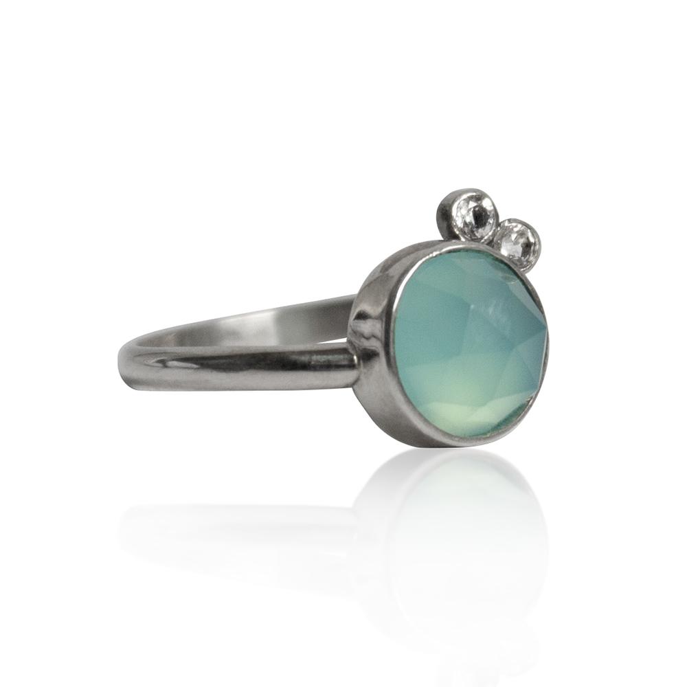 Aqua Chalcedony & White Topaz Sterling Silver Ring featuring an 8mm round aqua chalcedony and two 2mm round white topaz stones in a handcrafted design.